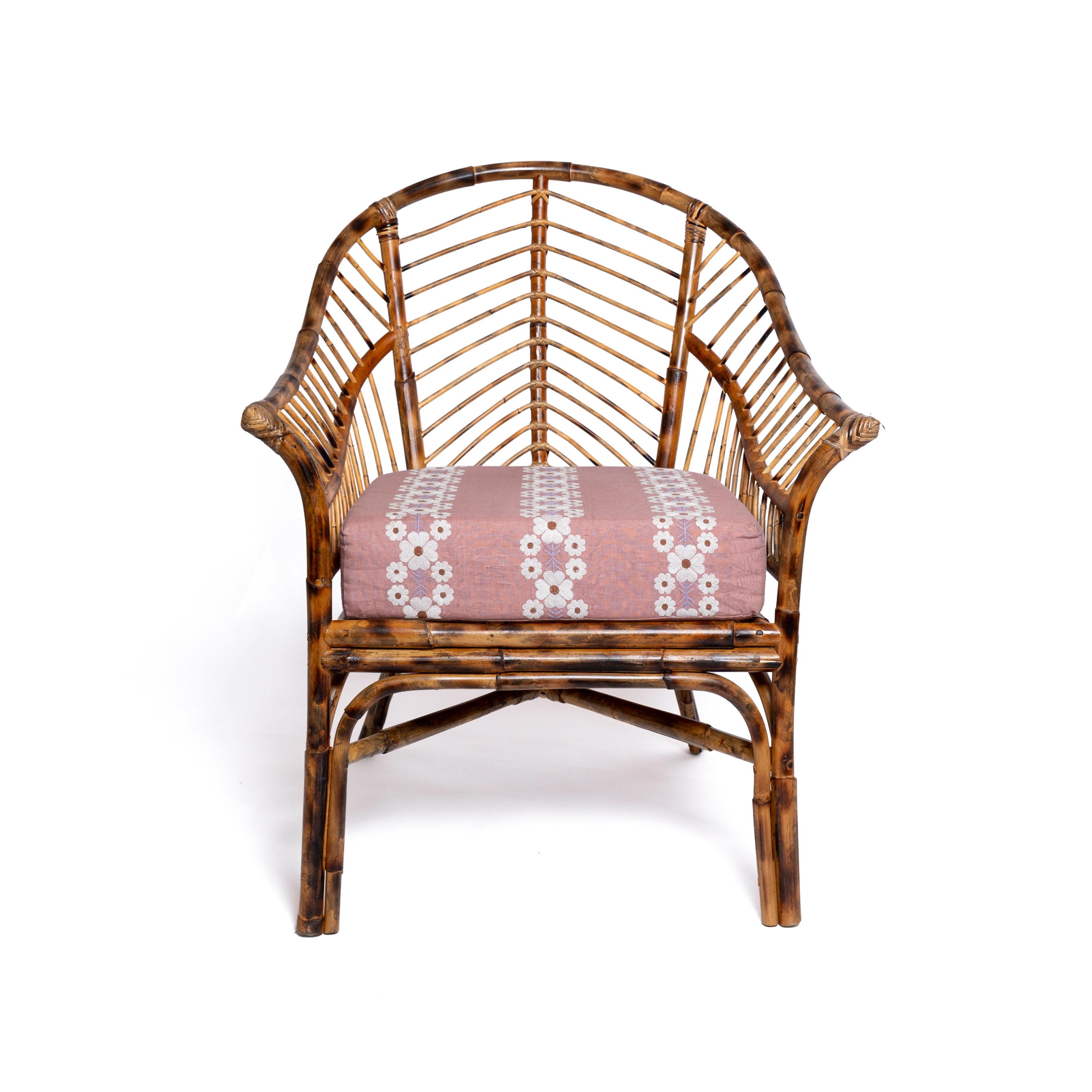 A truly versatile statement chair, designed to draw attention in the office, living room or at the dining table. Our Piolo faux bamboo chair is handcrafted from rattan and then torched, to look like antique bamboo. Choose from three cushion