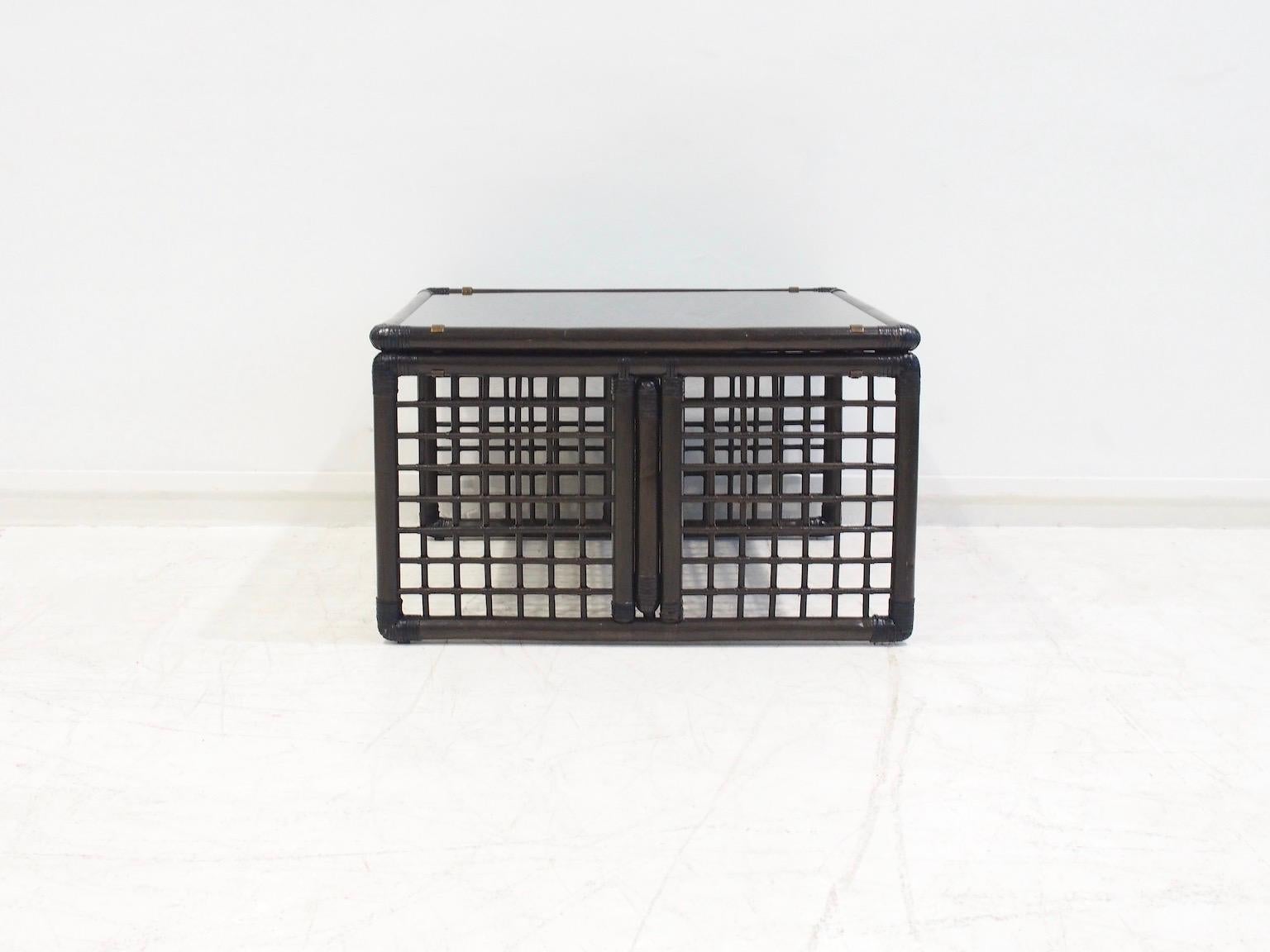 Coffee table, model Basilian, designed by Afra and Tobia Scarpa and produced by B&B Maxalto in the mid-1970s. The structure of the table is made of bamboo and rattan with brass details and a glass top.