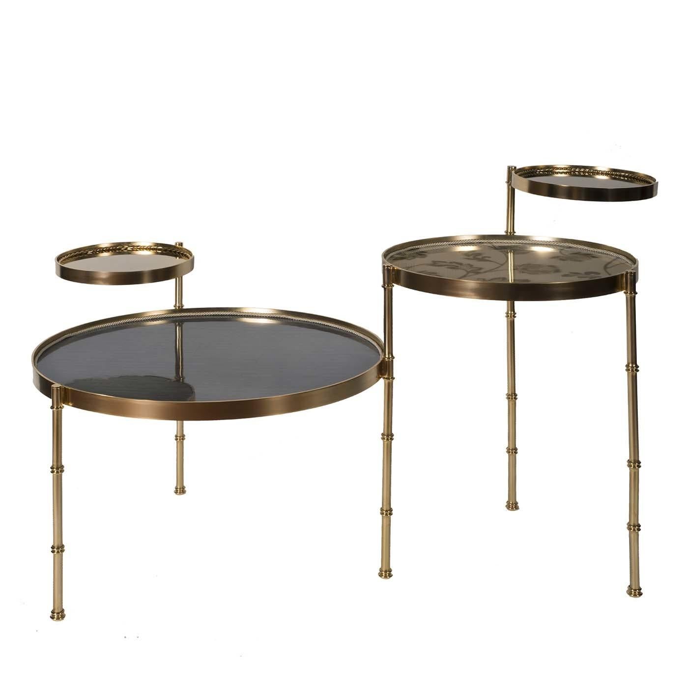 Exuding sleek allure, this coffee table will infuse bold character into any Minimalist decor. Its intricate silhouette is characterized by an interplay of shapes that reveals a cohesive design: crafted of brass with a satin gold finish, the table is