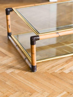 Bamboo coffee table with leather bindings and glass shelves by Fabrizio Smania