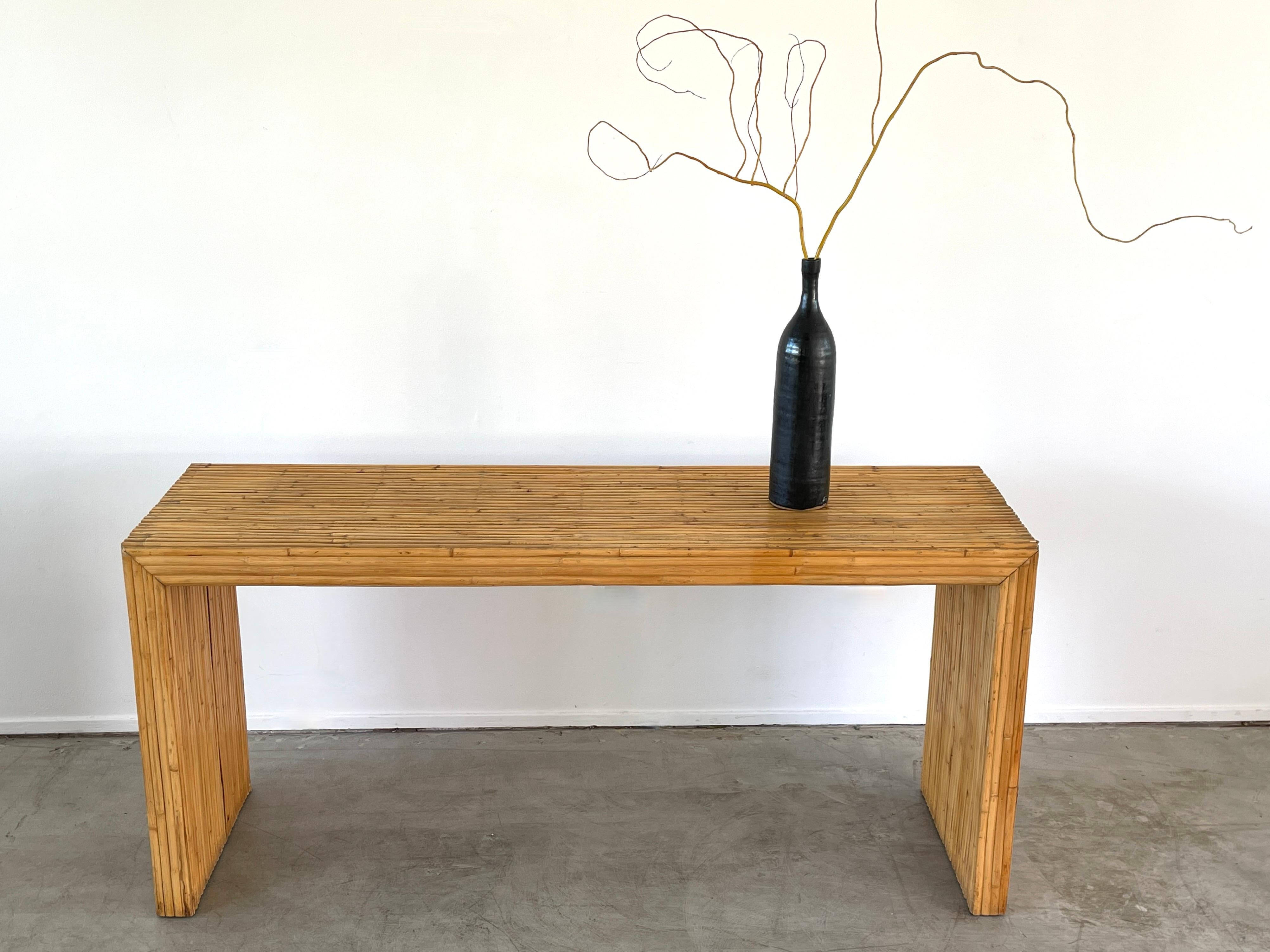 Simple Italian bamboo console with waterfall edge.
Italy, circa 1960's.