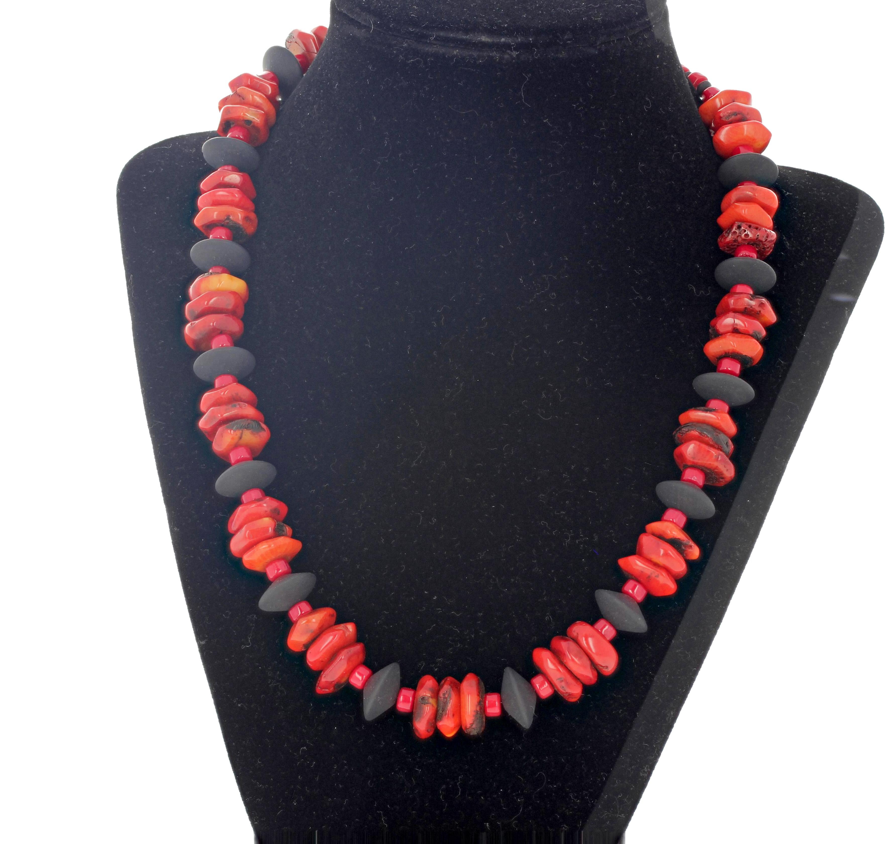Chunky polished slices of natural reddish-orangy Bamboo Coral (approximately 15 mm) adorned with elegant real Black Onyx and enhanced with polished rondels of real red Bamboo Coral.  This unique necklace is 19.5 inches long with a goldy clasp. 