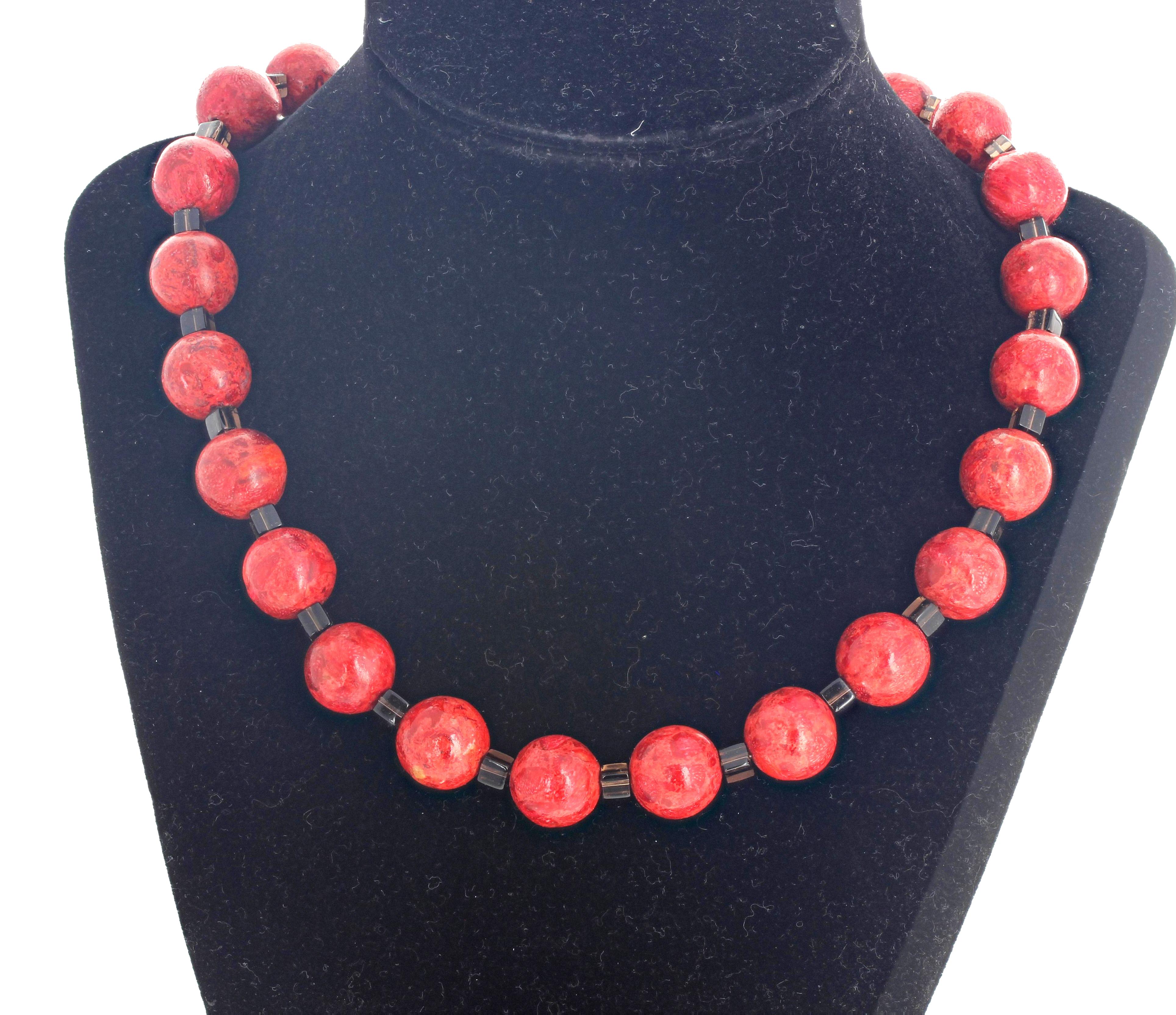 Highly polished Bamboo Coral ( 14 mm) accented with highly polished gem cut cubes of natural Smoky Quartz set in this 18 inch long necklace with easy to use antiqued silver hook clasp.  