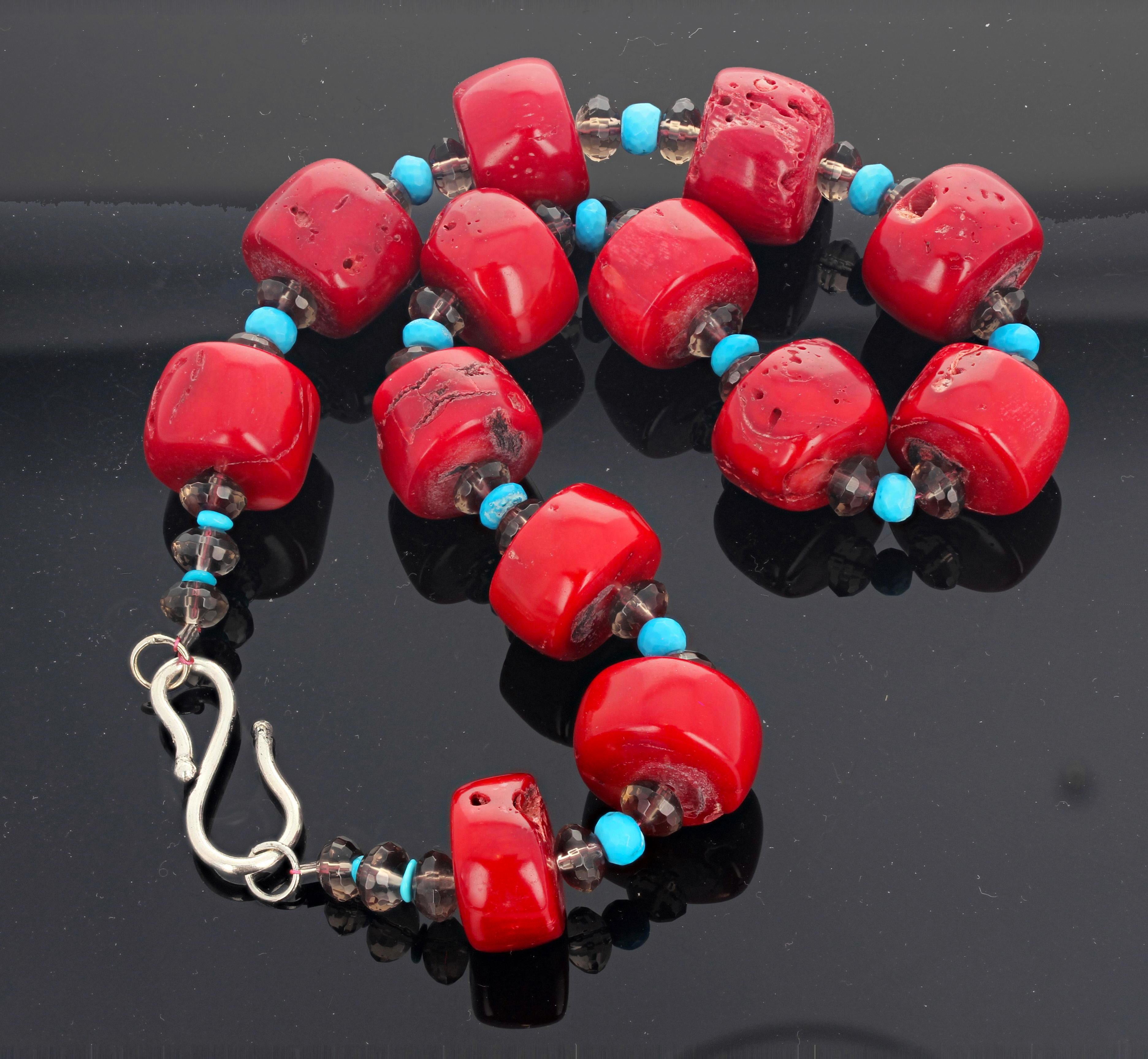Polished thick coin slices of fascinating natural Bamboo Coral (approximately 20 mm round) delightfully enhanced with gem cut  sparkling rondels of Smoky Quartz and natural Blue Turquoise set in a 16.5 inch long necklace with a silver hook clasp.  