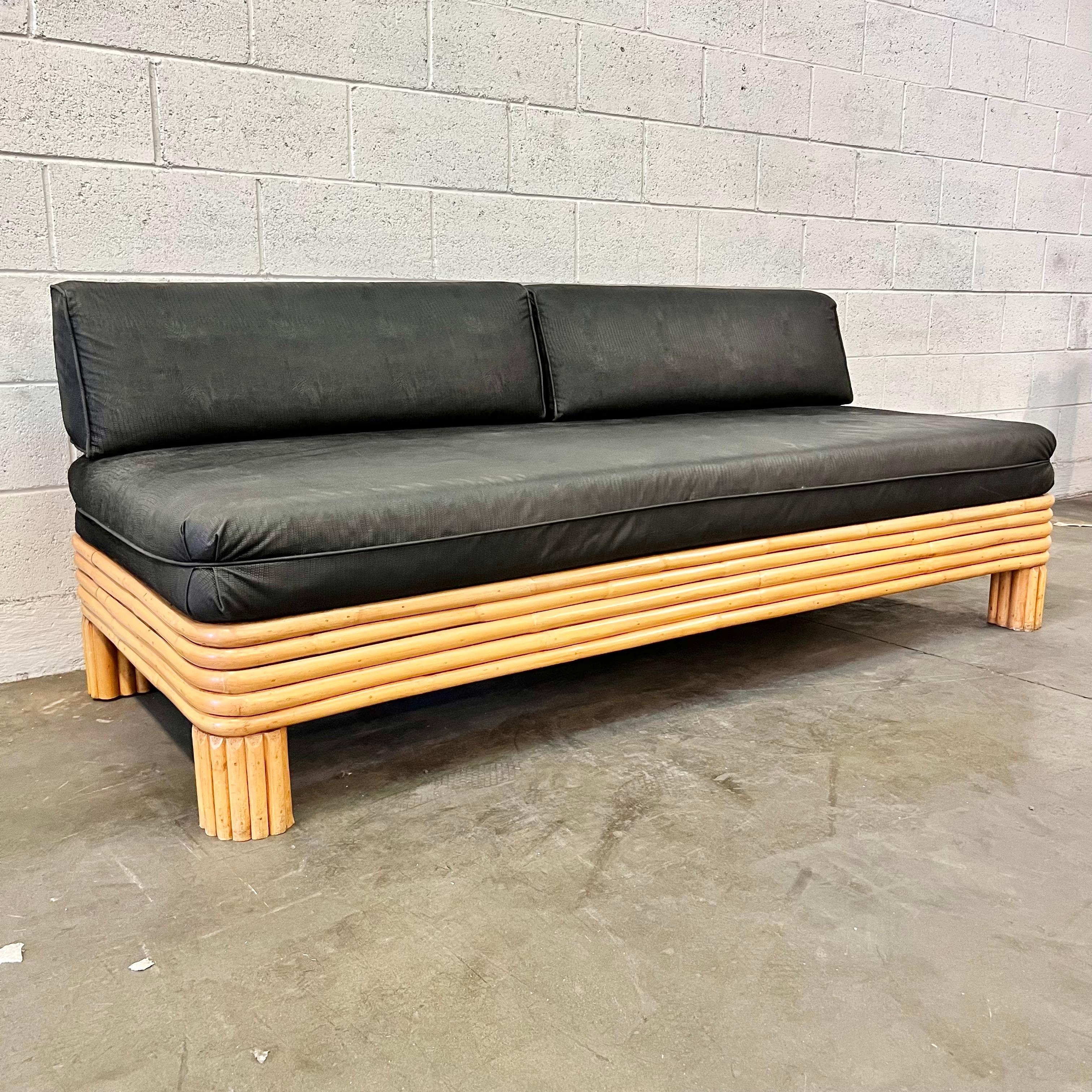 Elegant micro-suede daybed with a python pattern embossed into the fabric. Circa 1980s. Beautiful bamboo frame with a slatted wood back support. Good vintage condition. Super comfortable. Great scale and presence.
 