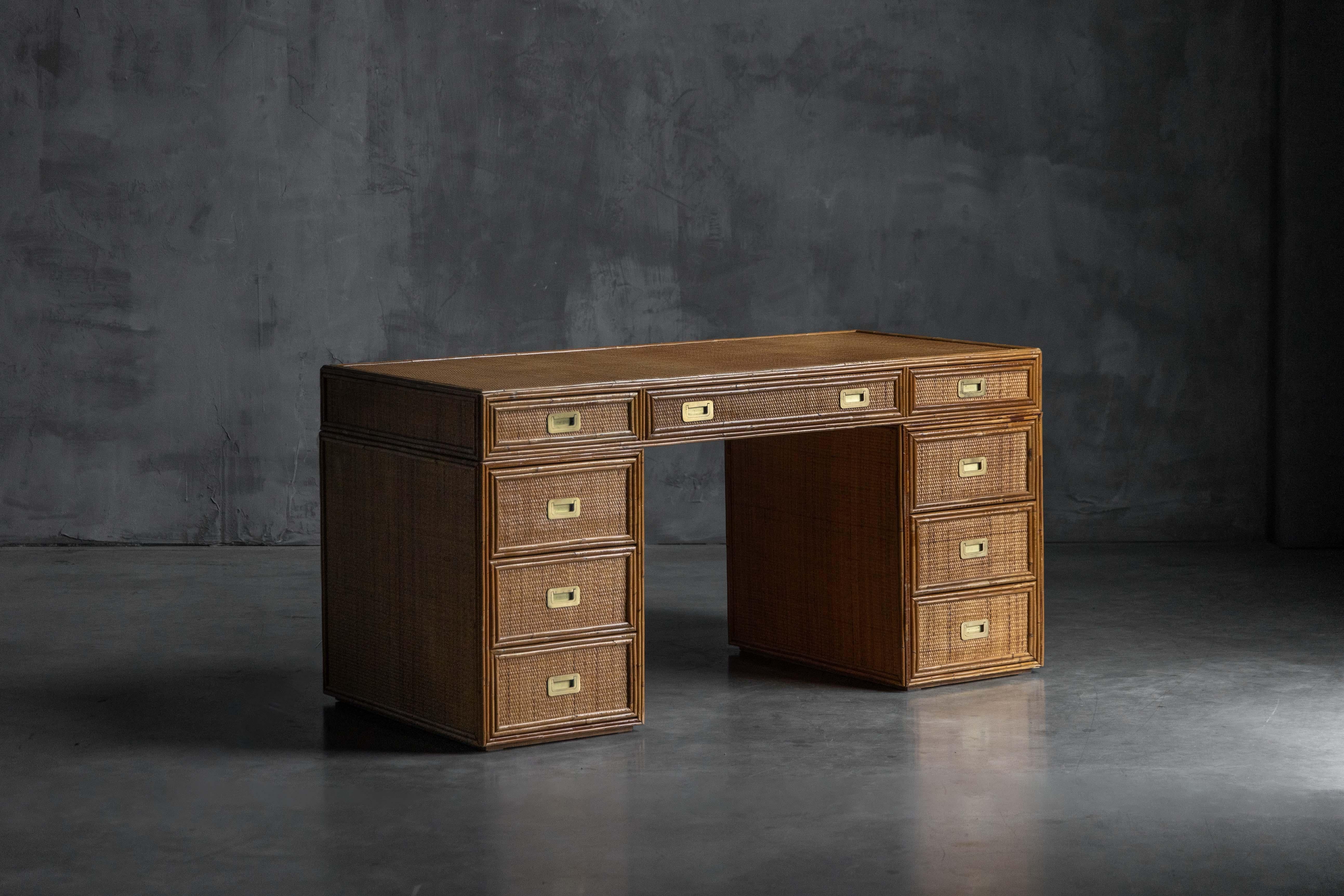 Bamboo and rattan desk by Vivai del Sud, crafted in Italy during the 1970s. The piece features nine drawers with brass handles and fine woven detailing, showcasing the brand’s signature craftsmanship and Mediterranean elegance. A refined example of