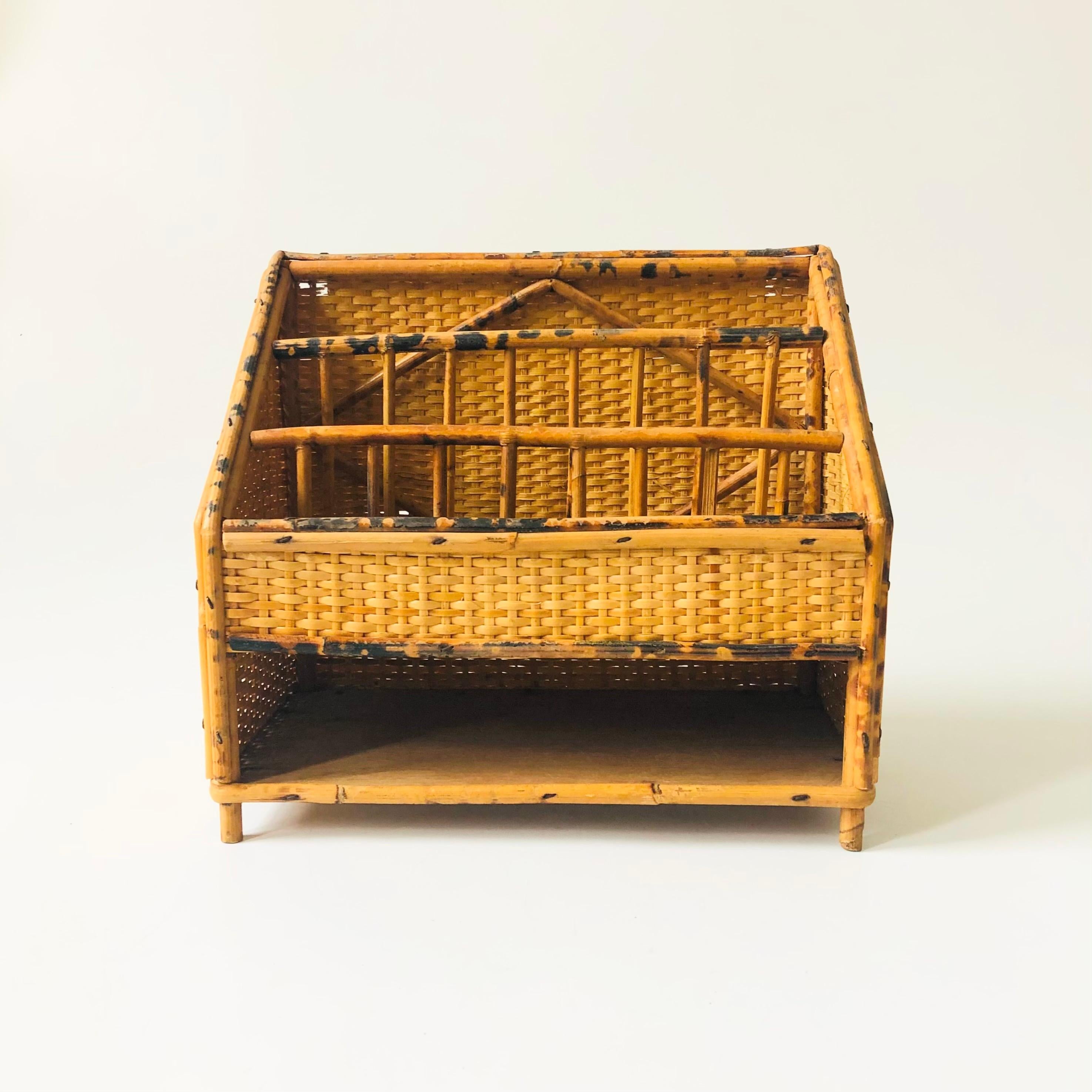 A vintage table top desk organizer. Made of bamboo and wicker. Beautiful tortoiseshell pattern to the bamboo. Features 4 divided compartments for organizing letters and office supplies.

