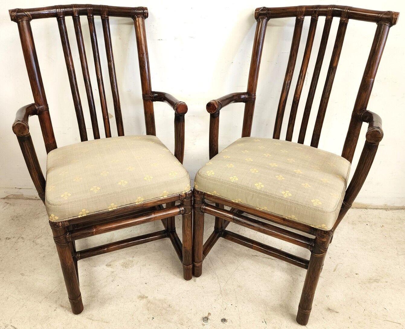 Offering one of our recent Palm Beach Estate fine furniture acquisitions of A. 
Set of 2 Vintage Asian Pogoda Style bamboo rattan dining chairs with silk seats by McGuire.

Crafted out of a sturdy bamboo secured with leather strapping. Each