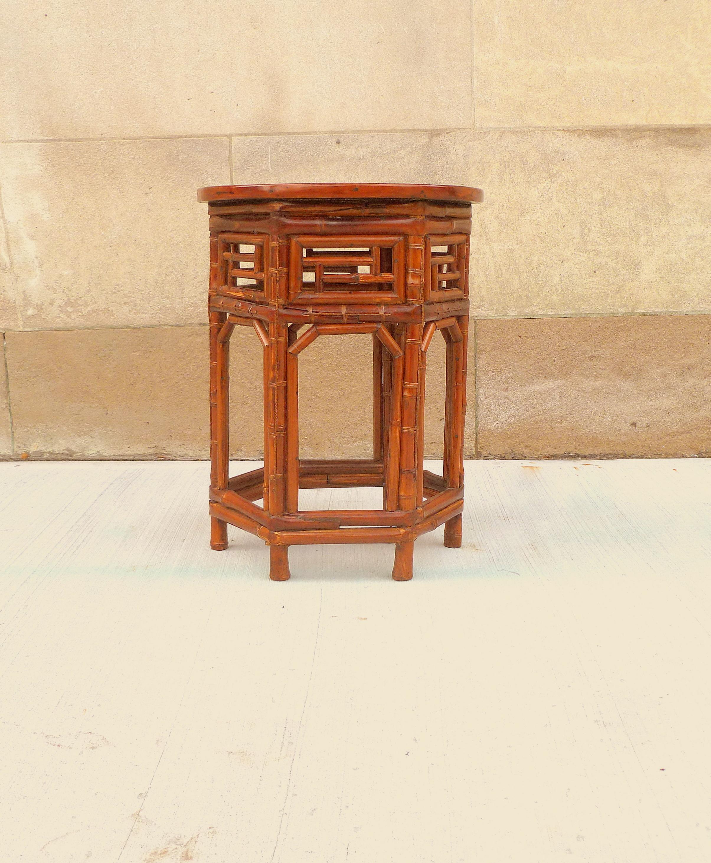 An elegant round bamboo end table with black lacquer top, beautiful form and lattice fret work. We carry fine quality furniture with elegant finished and has been appeared many times in 