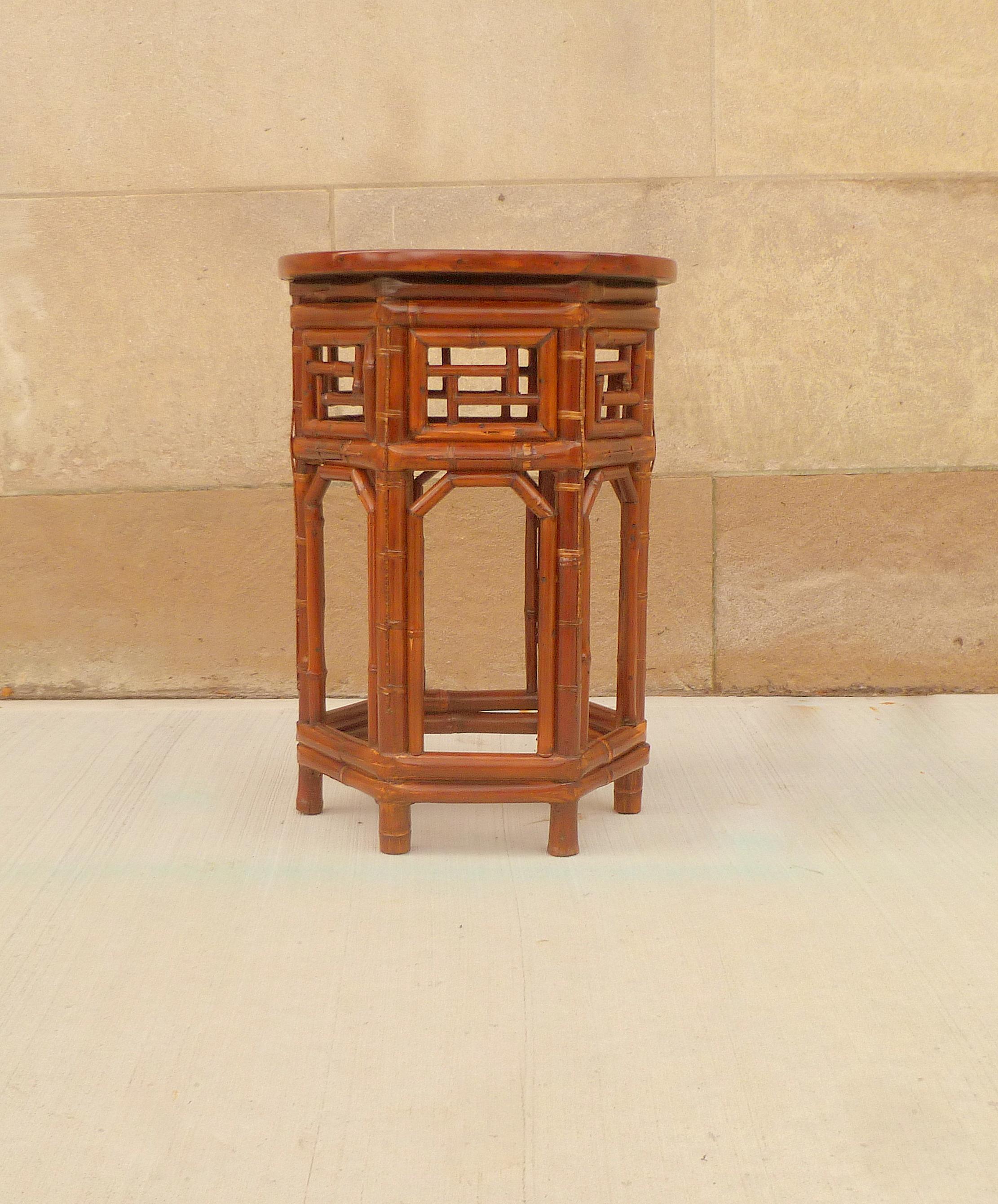 An elegant round bamboo end table with black lacquer top, beautiful form and lattice fret work. We carry fine quality furniture with elegant finished and has been appeared many times in 