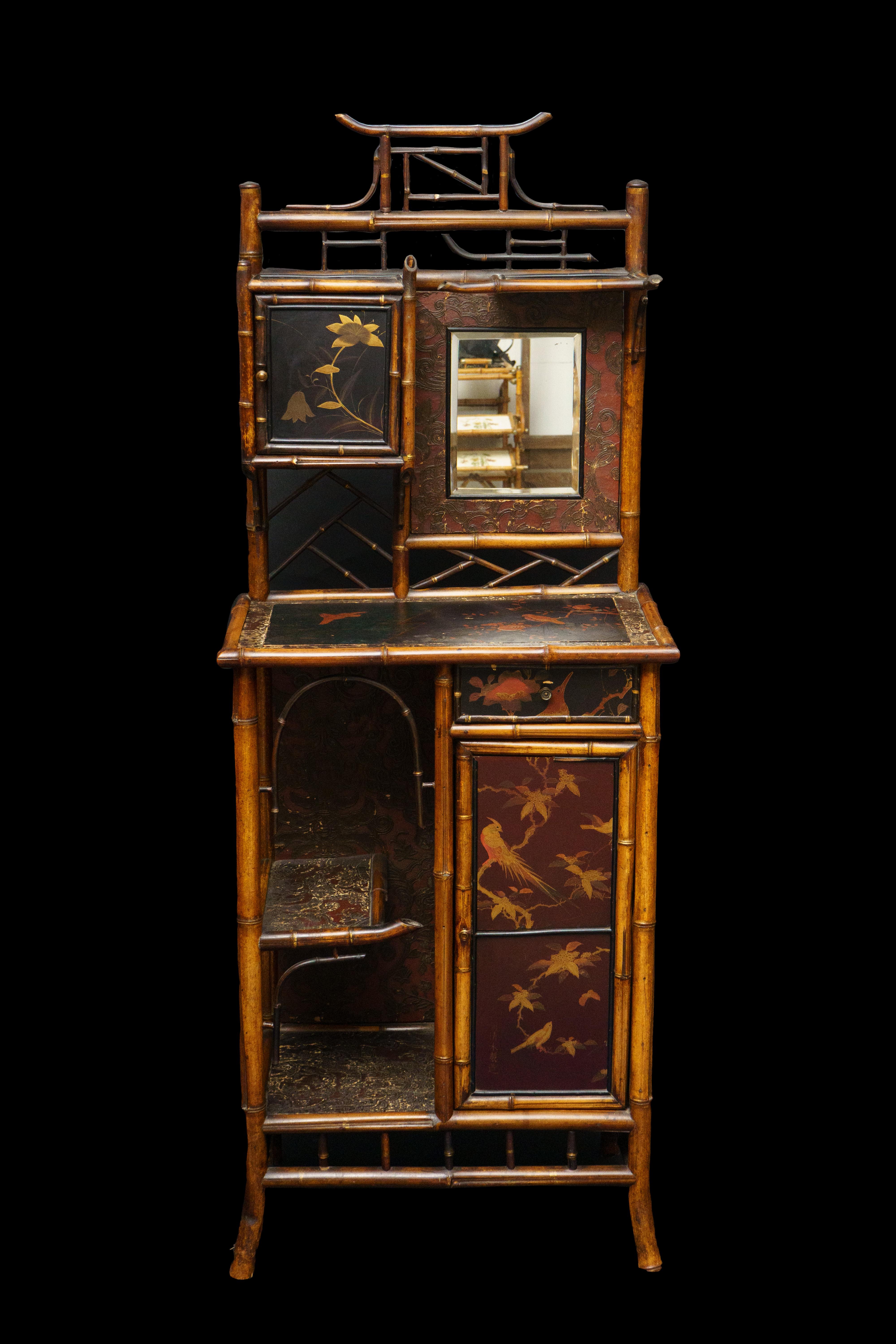Asian inspired early 20th Century Bamboo Etagere Cabinet and mirror with embossed leather and painted Panels. 

Measures: 25