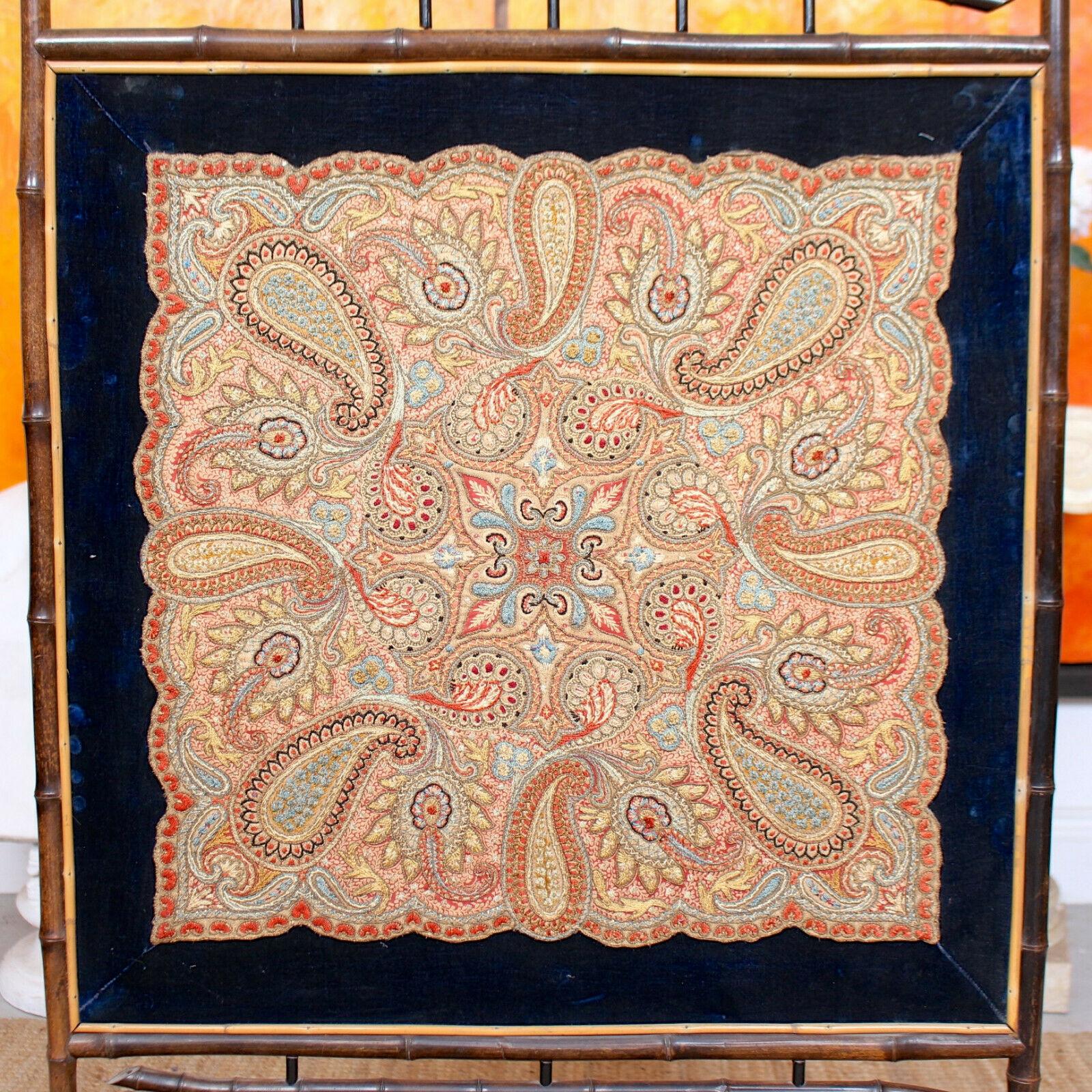 An attractive late 19th century Aesthetic movement fire screen in the Japanese taste, fitted an ornate needlework panel encased within a bamboo frame.

England, circa 1880.