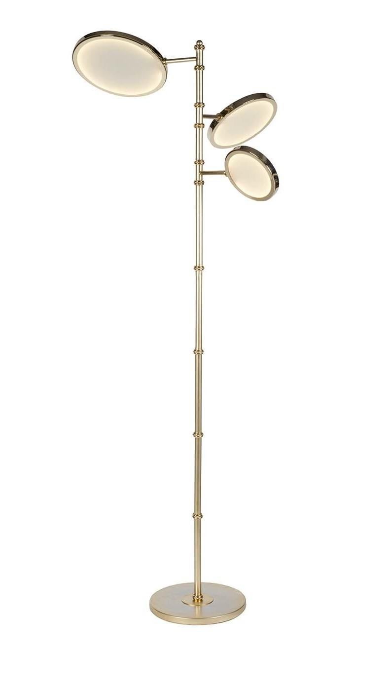 Fusing artistry with functionality, this sculptural floor lamp will bring modern style and diffuse warm light into any room. Crafted of brass with satin gold finish, its sleek silhouette is defined by the tall, slender stem and three LED ring lamps
