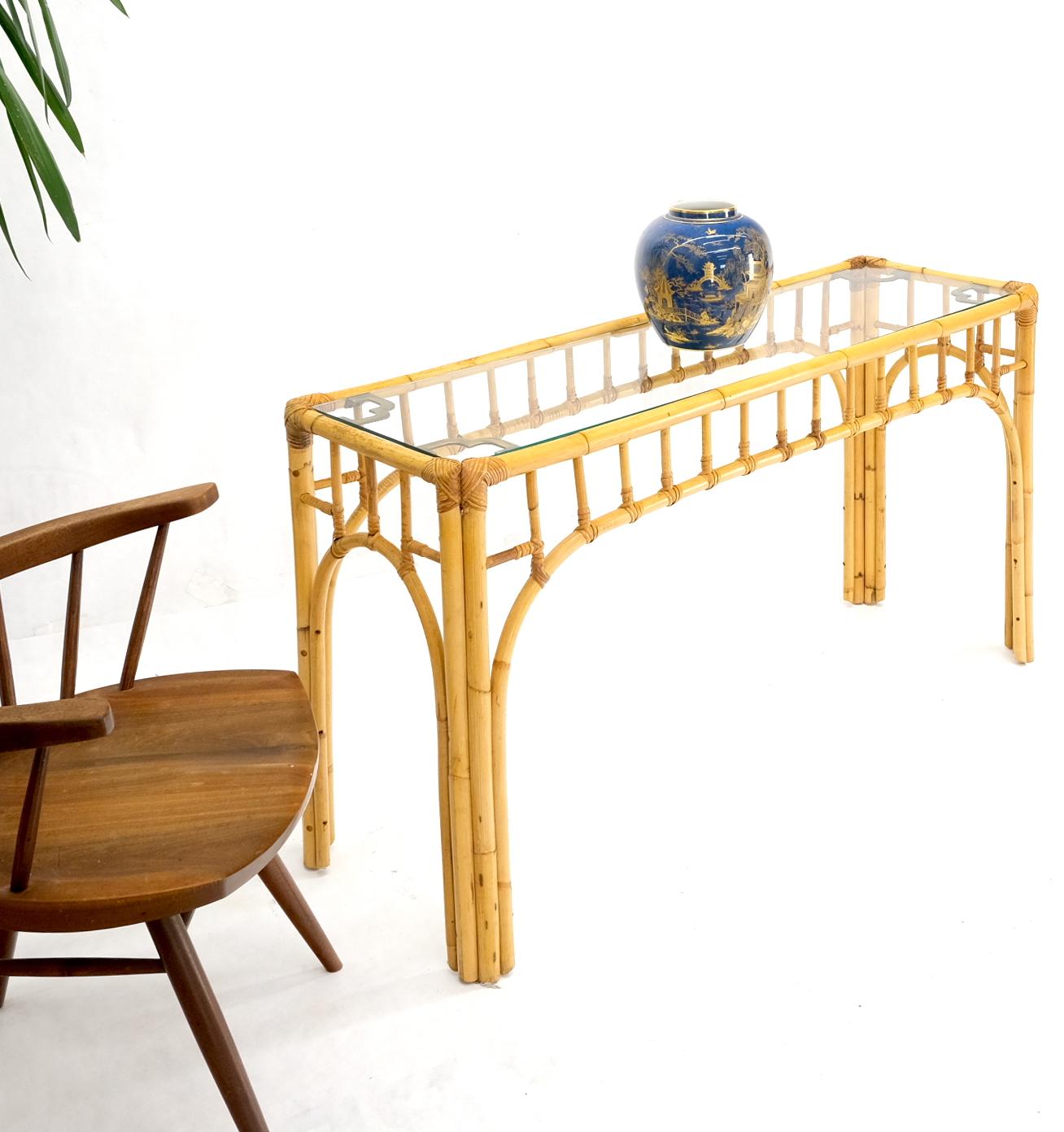 Mid-Century Modern bamboo console table with glass top.
