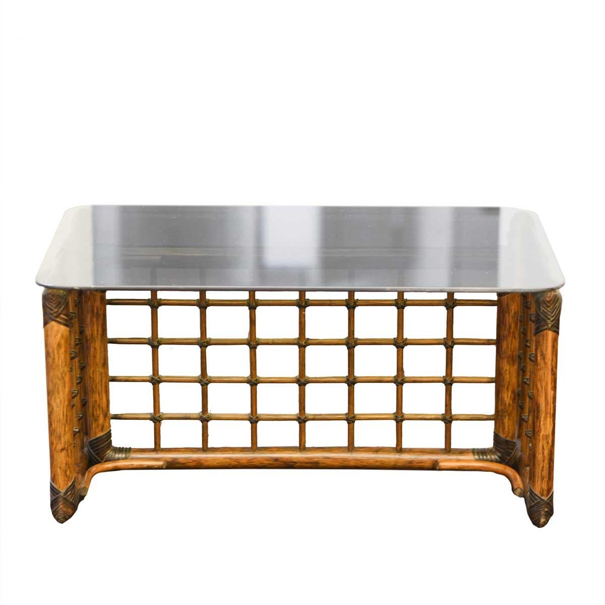 Coffee table with rattan structure and glass top.
This small table, which can be used in a thousand different ways, was designed in 1970 by a couple of architects: Tobia Scarpa and Afra Bianchin. The two met at the IUAV and never left each other.