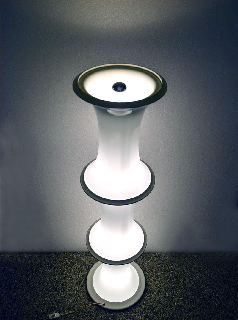 Bamboo floor lamp produced by Tronconi for Vistosi Murano, 1970s.
Composed of 3 pieces in blown glass with painted metal structure and rings.
Original electrical system with 3 independent switches, it is possible to light the entire glass part, only