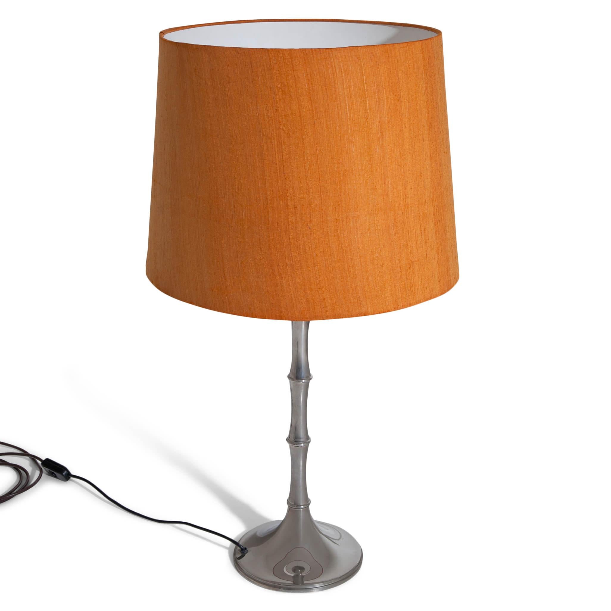 Bamboo table lamp standing on a stylized bamboo metal foot. Design by Ingo Maurer for Design M. For the electrification we assume no liability and no warranty.
 