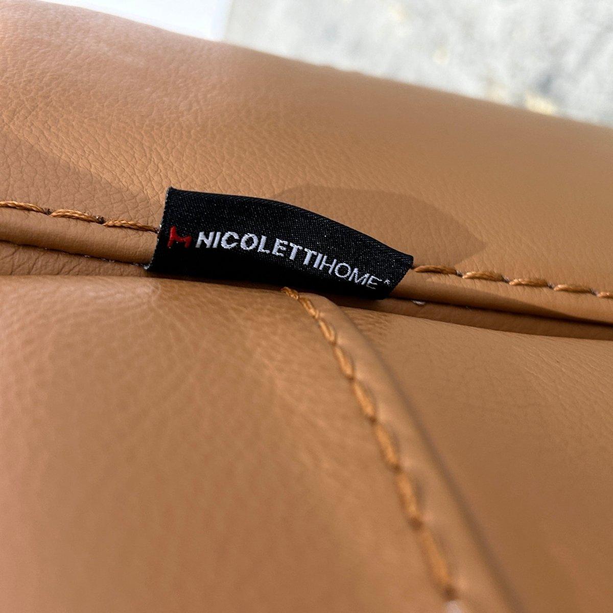 Elevate your living space with the Bamboo Leather Armchair by Nicoletti, which would make a stunning addition to a range of interior decor styles. Crafted with the finest materials, this armchair boasts a sleek and modern design, featuring plush