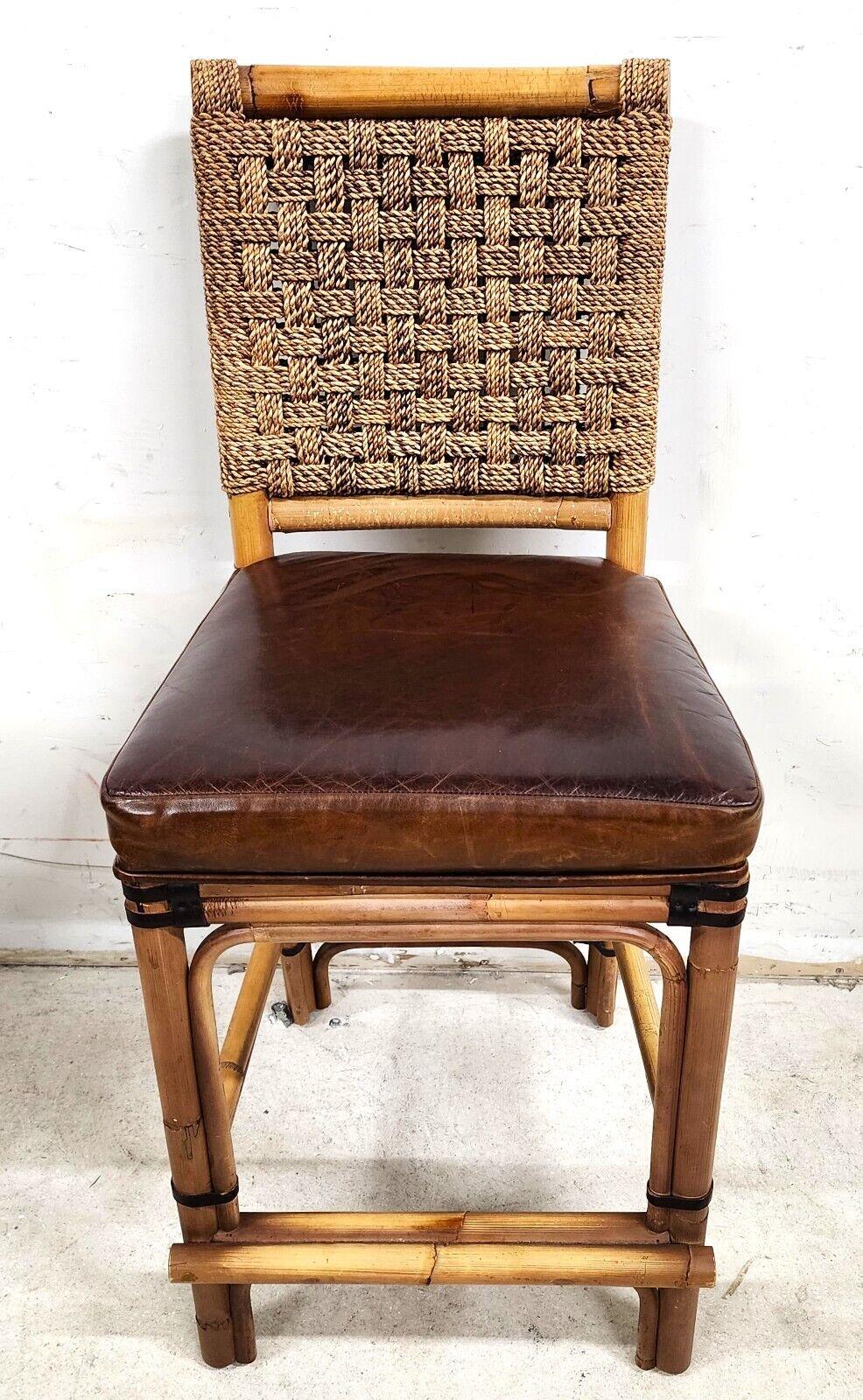 For FULL item description click on CONTINUE READING at the bottom of this page.

Offering One Of Our Recent Palm Beach Estate Fine Furniture Acquisitions Of A
Bamboo and Leather Counter Stool with Rattan & Braided Rope by PALECEK

Approximate