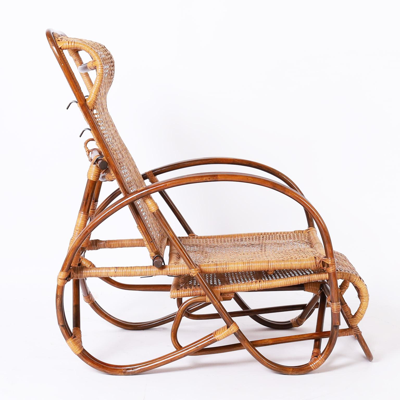 Vintage lounge chair crafted with bent bamboo and woven rattan in an elegant modern form featuring pullout footrest and adjustable back.

Extended depth 60