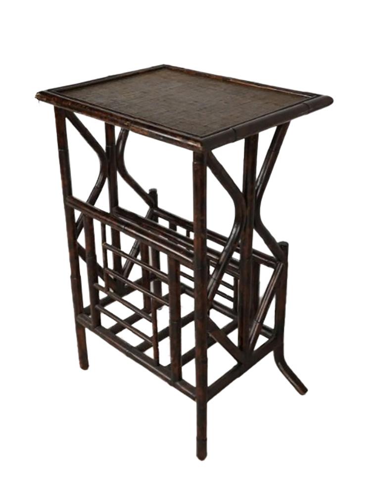 An exquisite bamboo magazine table, featuring a hand-painted rattan top that exudes elegance and craftsmanship. This unique piece comes with a prestigious provenance, having been originally placed by the renowned designer Michael S. Smith in Jim