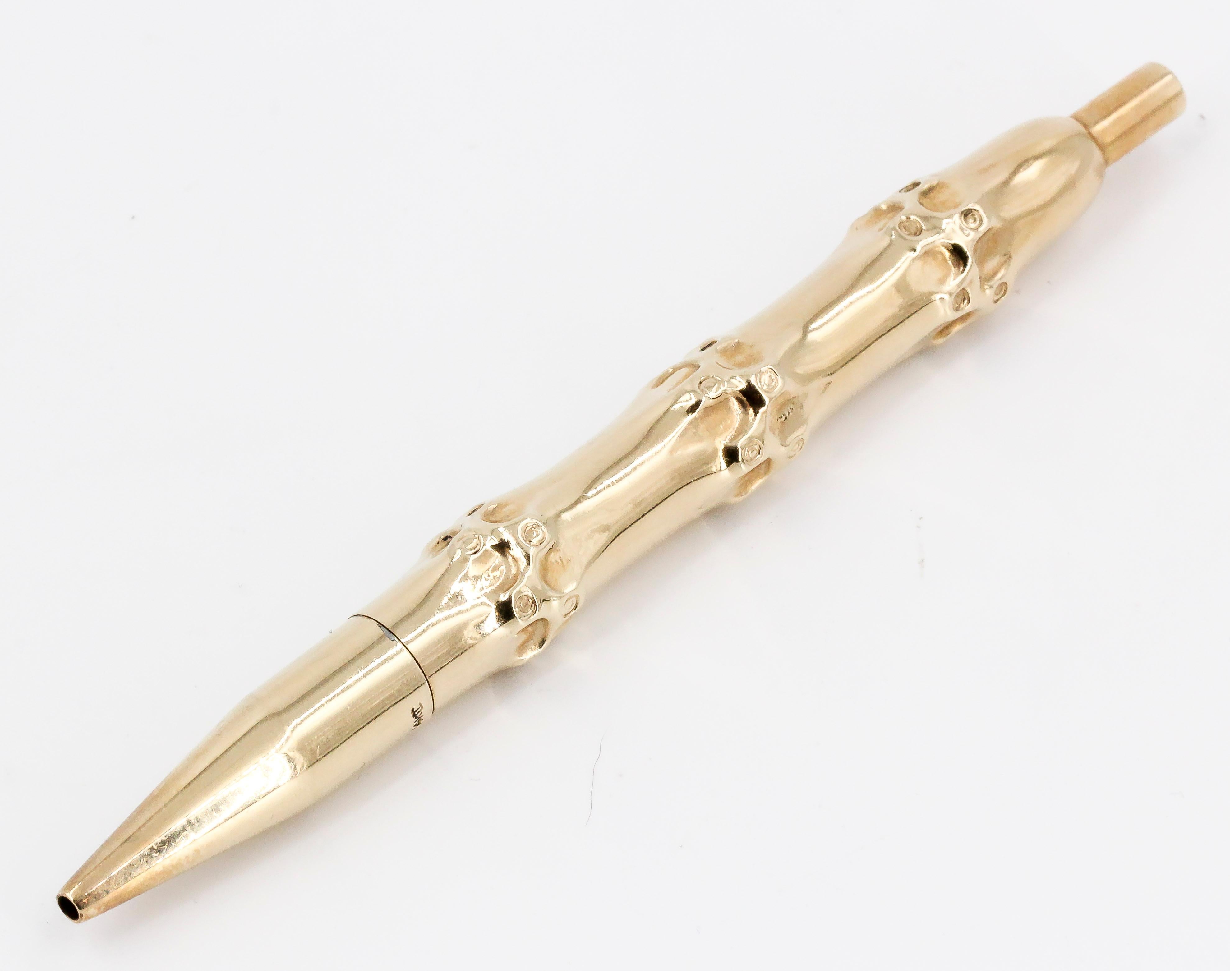 Elegant 14K yellow gold bamboo motif purse ballpoint pen. 

Hallmarks: 14kt
