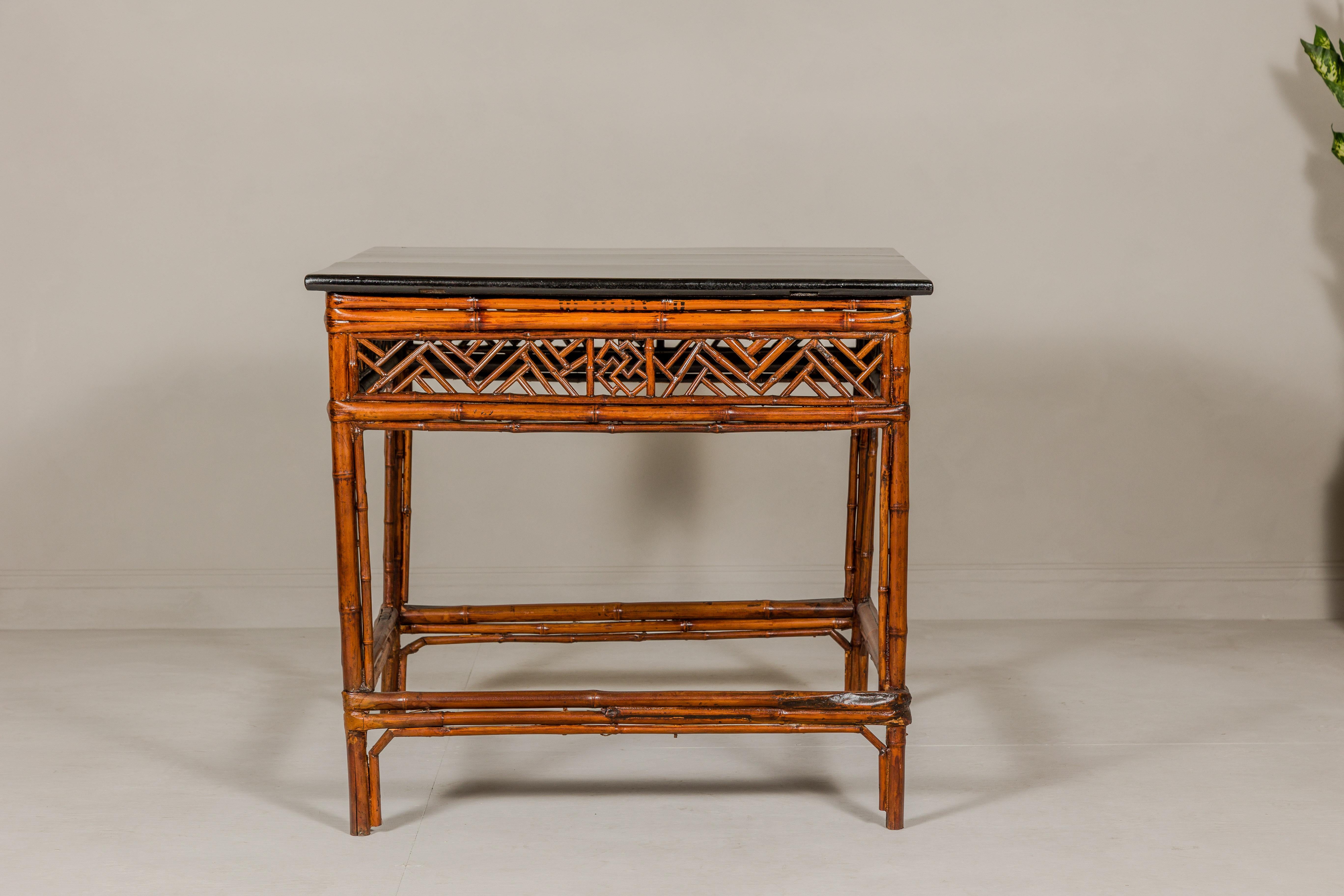 Chinese Bamboo Qing Dynasty Center Table with Geometric Apron and Black Lacquered Top For Sale