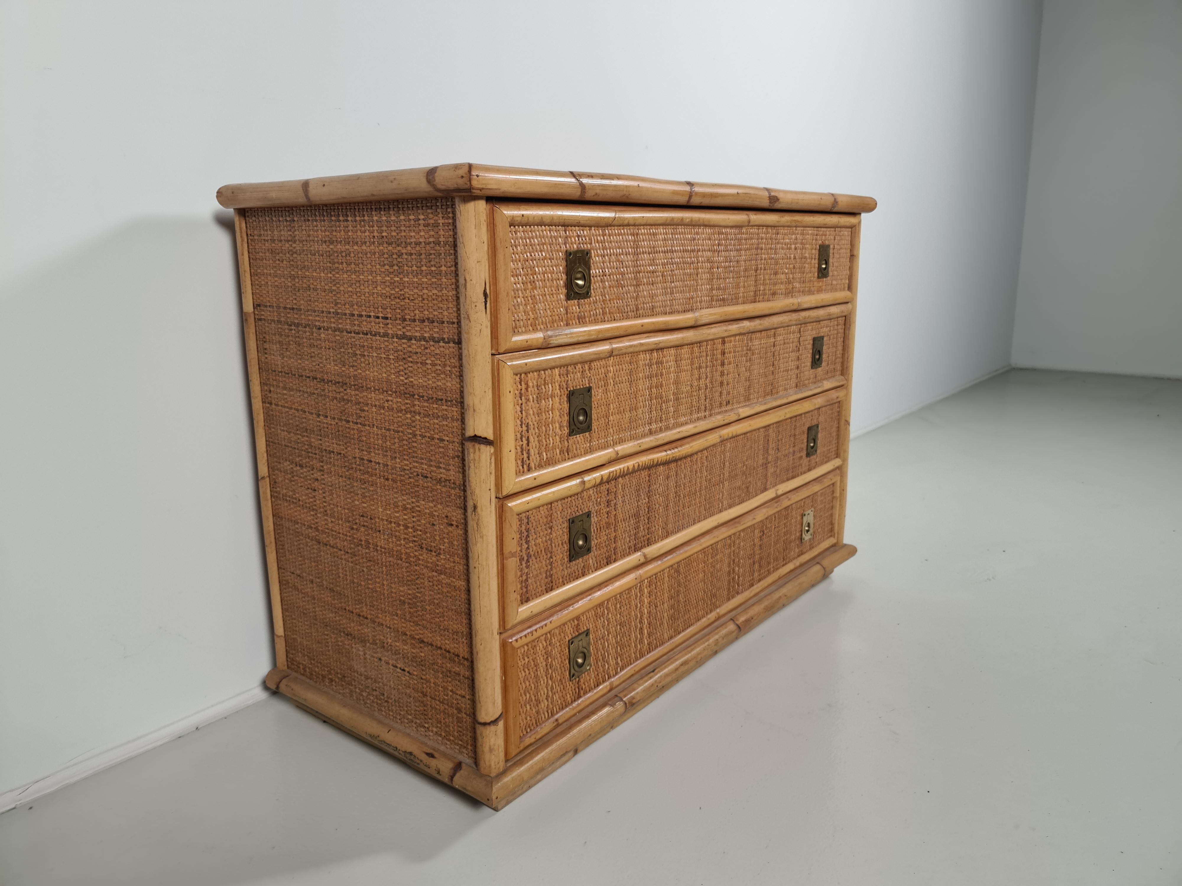 Nice mix of bamboo, rattan raffia wicker and brass handle chest of drawers or commode by the manufacture Dal Vera. 

 The brass handles on the drawers are lovely examples of high-quality craftsmanship. The design was inspired by mid-century modern