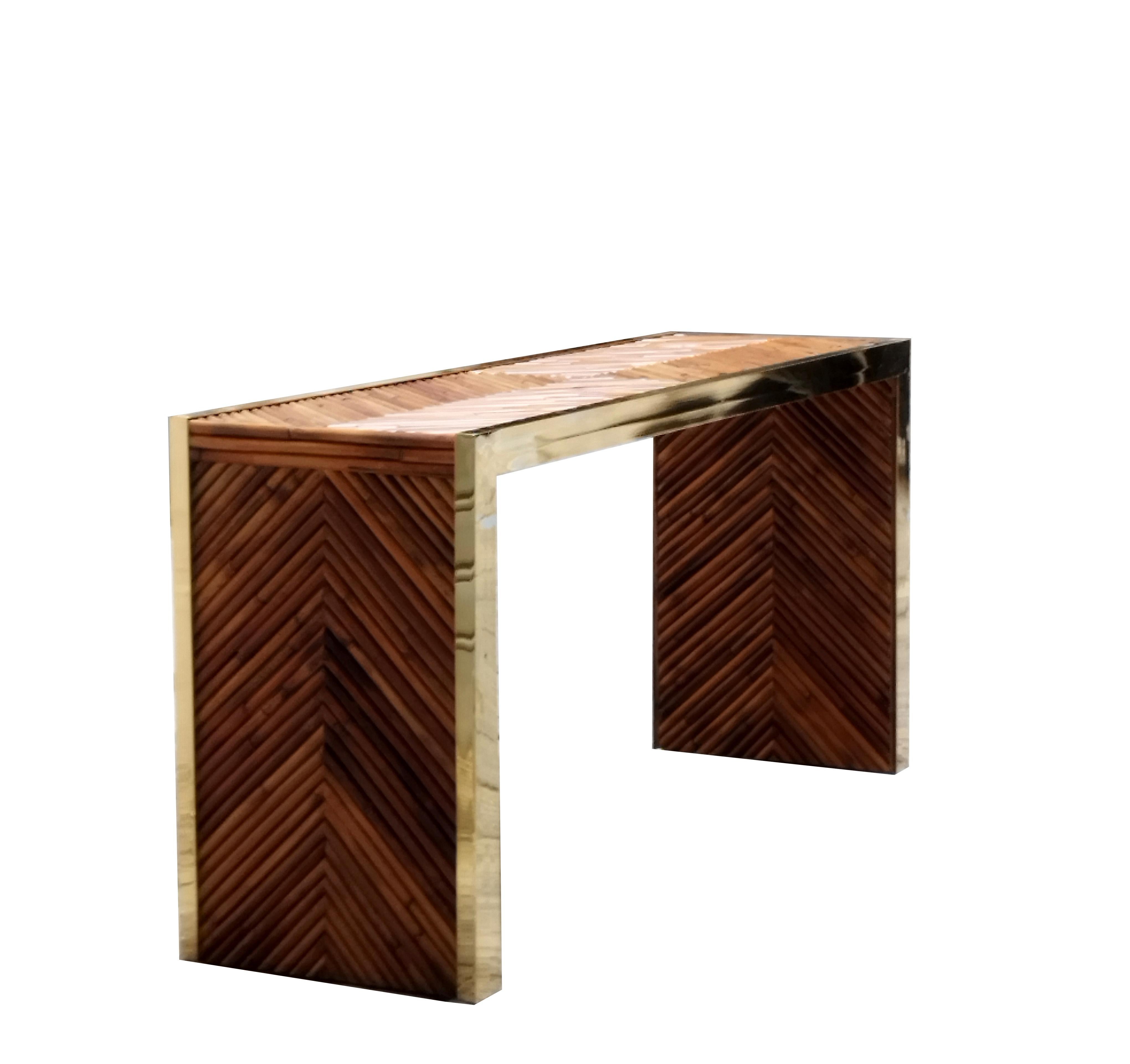 Modern console table with bamboo and brass top. It can be placed either as a centre piece or wall-mounted. Entirely handmade from rattan and brass, it is unique and beautiful. Artisanal work in the mood of Dal Vera, Vivai del Sud, Hollywood Regency.