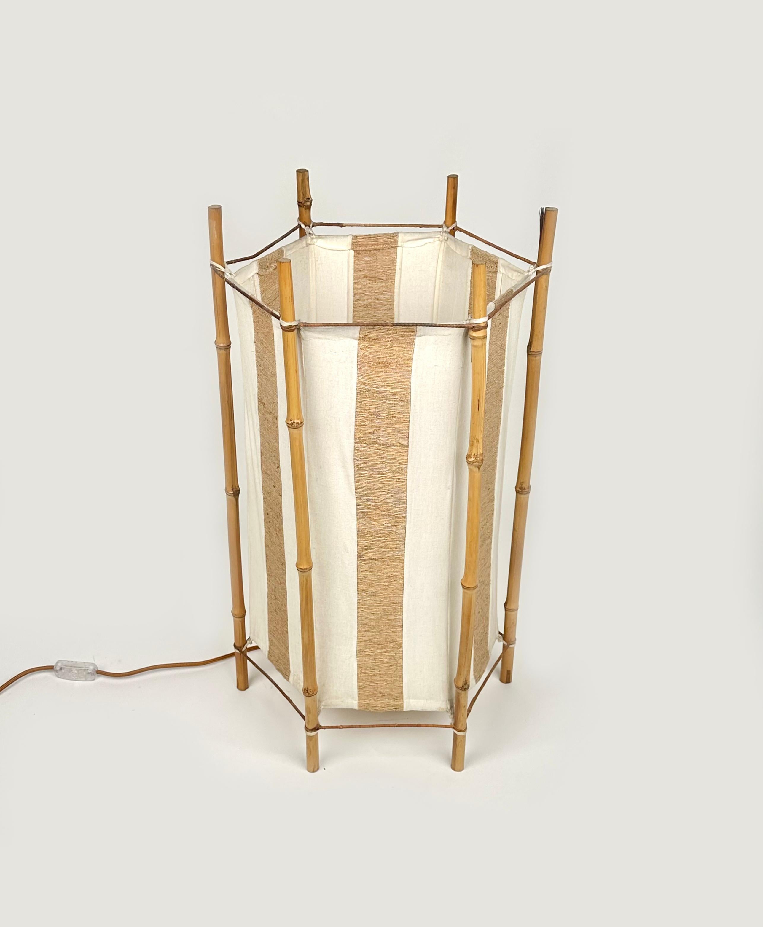 Amazing floor lamp or table lamp in white and brown cotton featuring structure in bamboo composed of six stems in the style of to the French designer Louis Sognot.

Made in Italy in the 1960s. 

Electrical system has been renewed. 

It uses 1