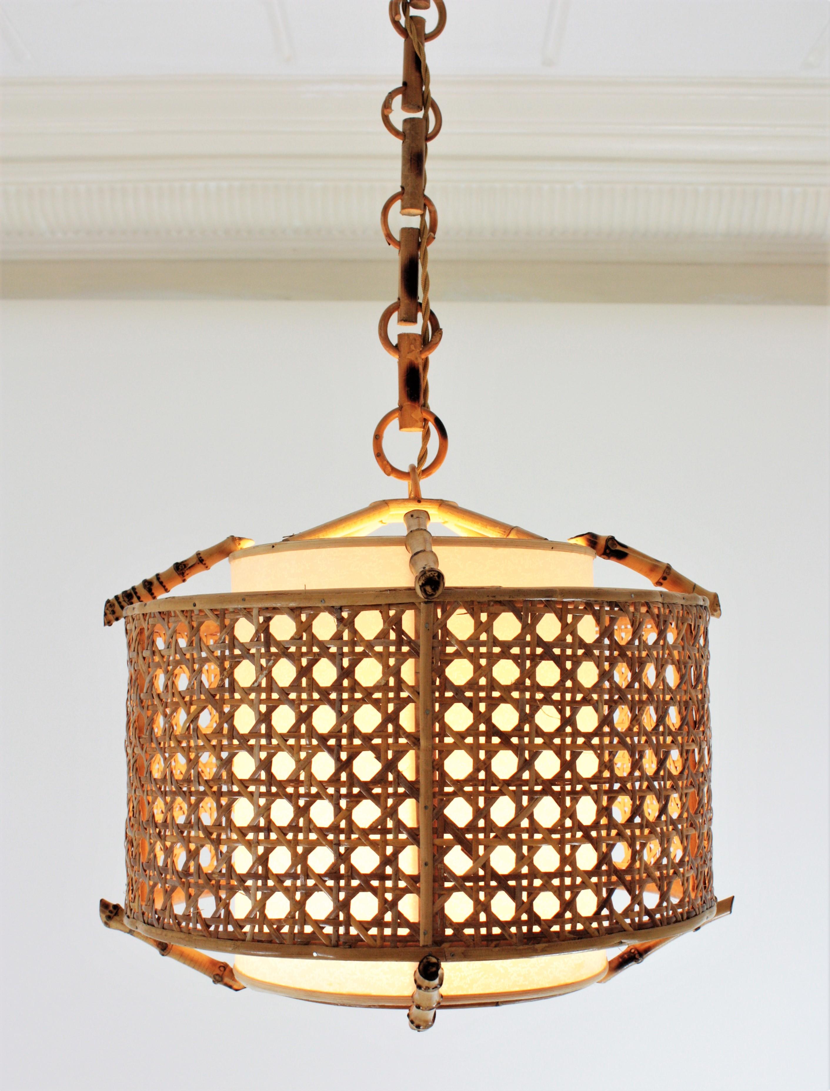 Spanish Bamboo Rattan and Wicker Weave Drum Pendant Lamp or Lantern with Tiki Accents
