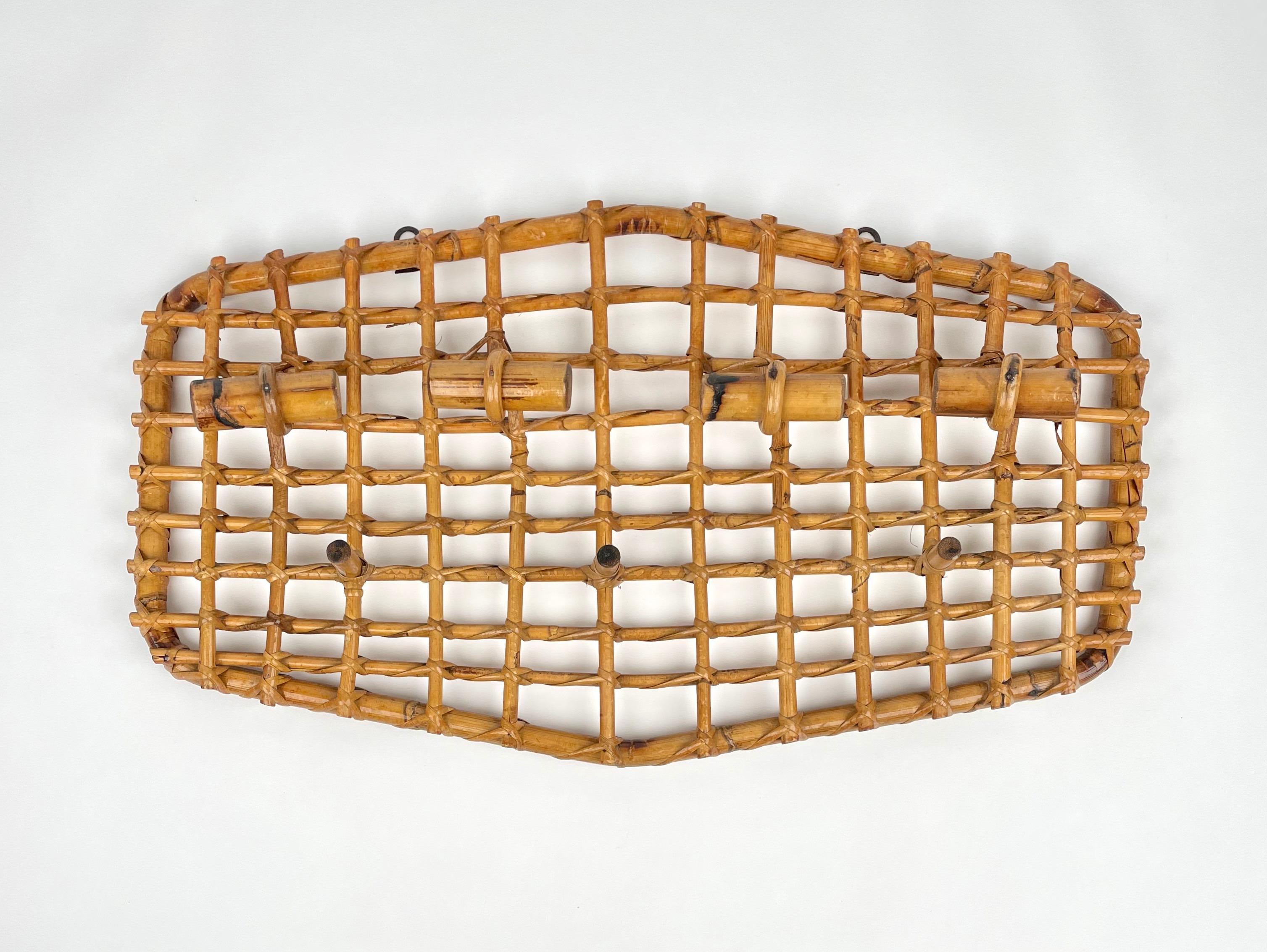 Four-hooks coat hanger in bamboo and rattan attributed to the designer Olaf von Bohr. Made in Italy in the 1950s.