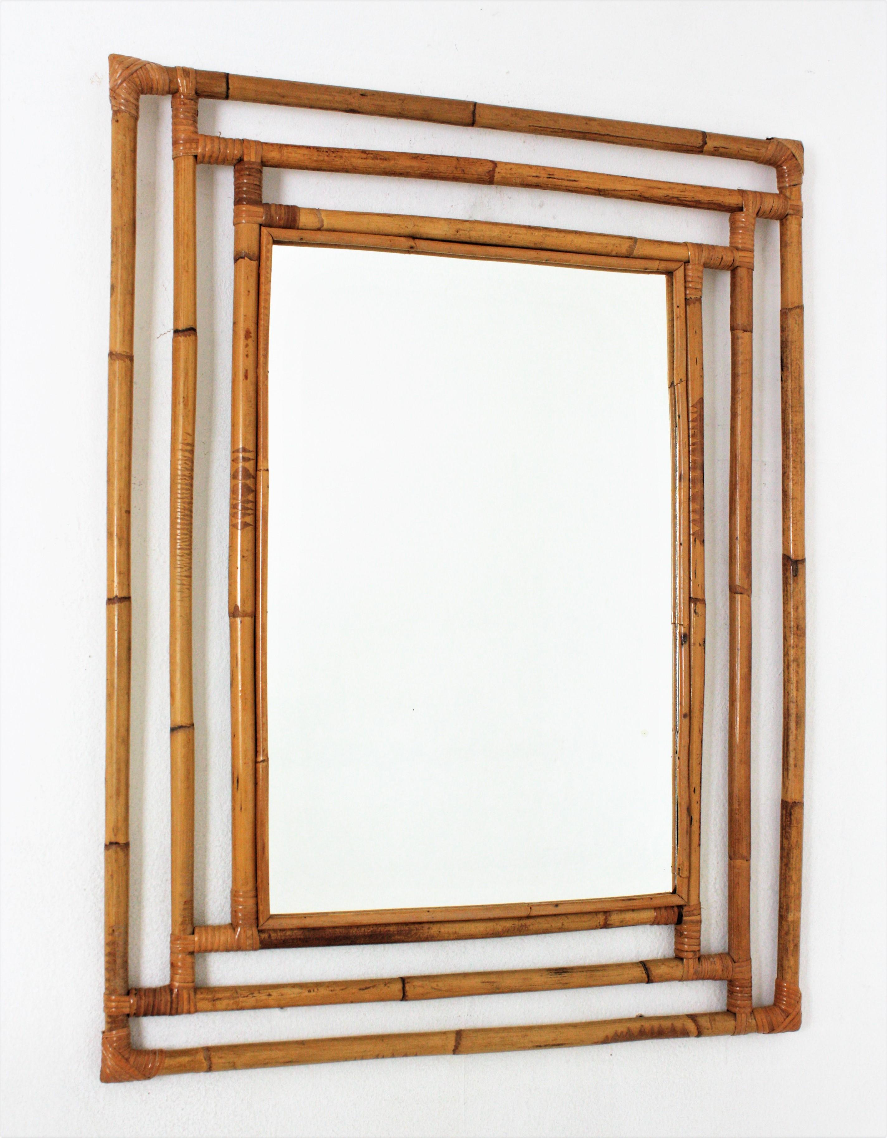 Gorgeous Tiki style rectangular mirror handcrafted with bamboo cane. Spain, 1960s.
Highly decorative handcrafted bamboo frame with geometric shapes, oriental accents and a large glass surface,
This mirror is in excellent vintage condition.
It