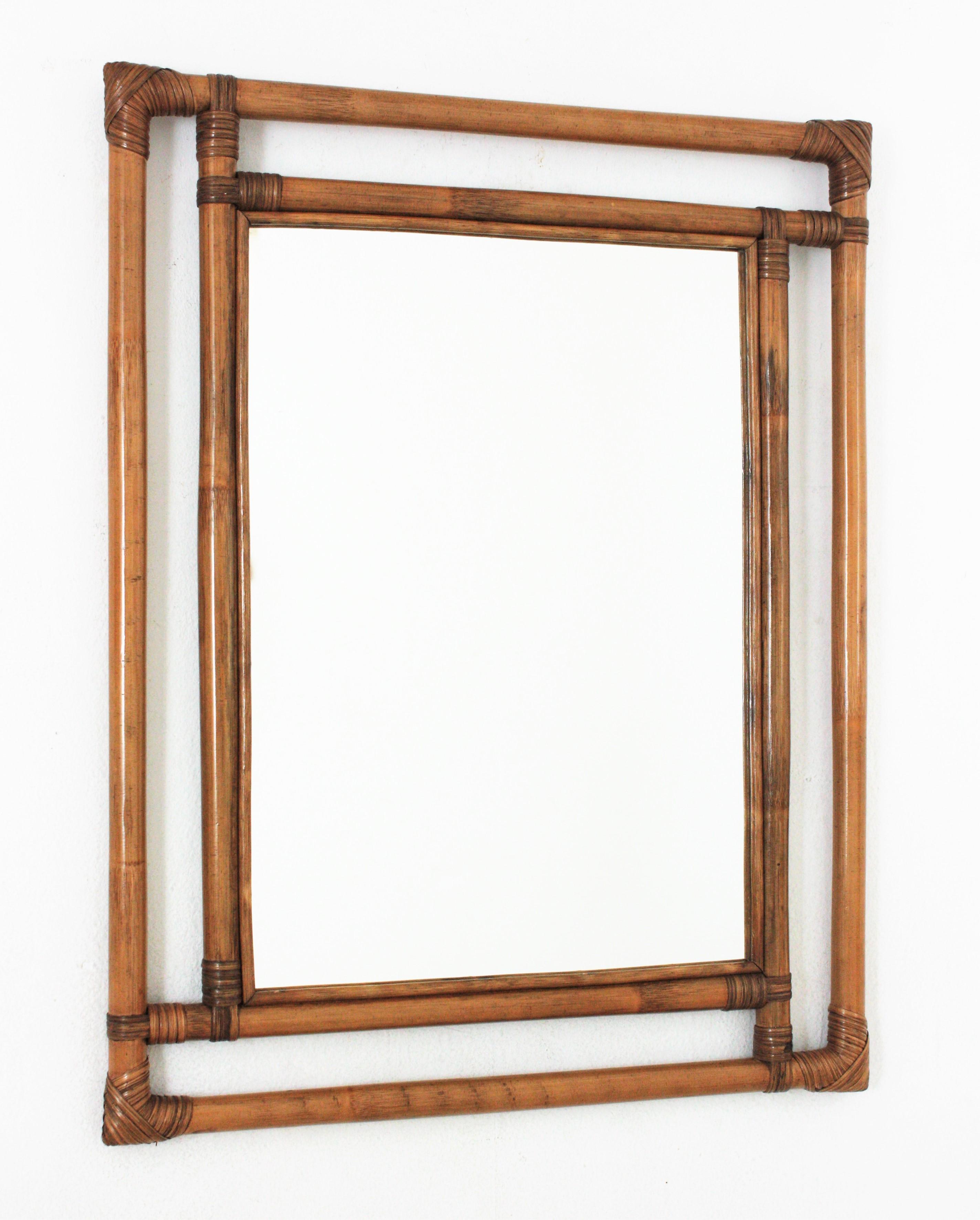 Gorgeous Tiki style rectangular mirror handcrafted with bamboo cane. Spain, 1960s.
Highly decorative handcrafted bamboo frame with geometric shapes, oriental accents and a large glass surface,
This mirror is in excellent vintage condition.
It will