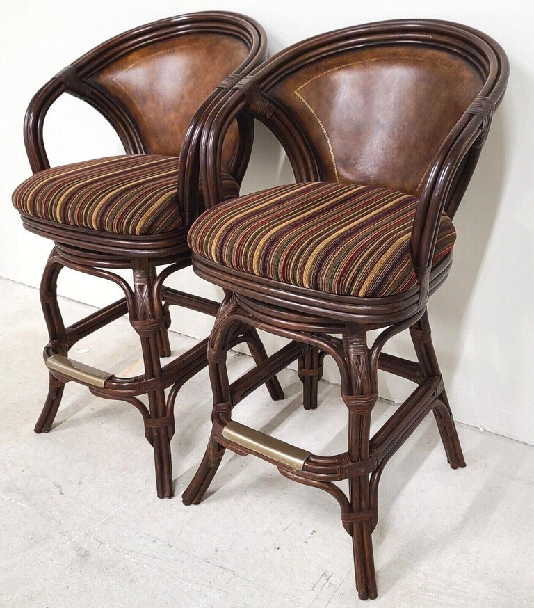 Offering one of our Recent Palm Beach Estate Fine Furniture Acquisitions of a set of 2 HOOKER Bamboo Rattan Leather Swivel Barstools

This listing and price are for the 2 stools in the first 8 photos only. 

Approximate Measurements in