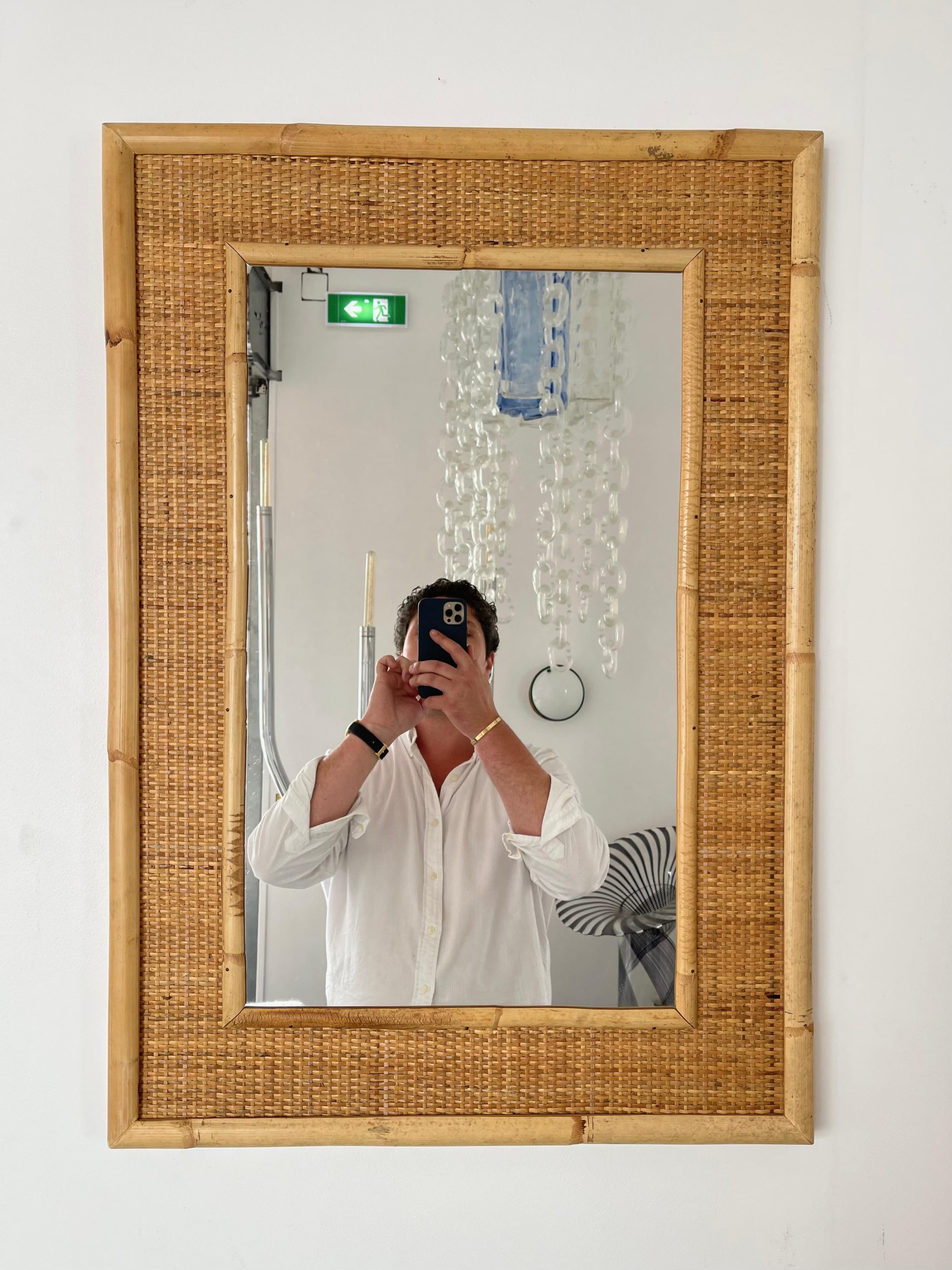 Mid-Century Modern Hollywood Regency Wall mirror nice mix of bamboo, rattan raffia wicker by the manufacture Dal Vera. Famous design like Renato Zevi, Romeo Rega, Maison Jansen, Willy Rizzo, Mario Sabot.

2 mirror available. In sale separately.
For