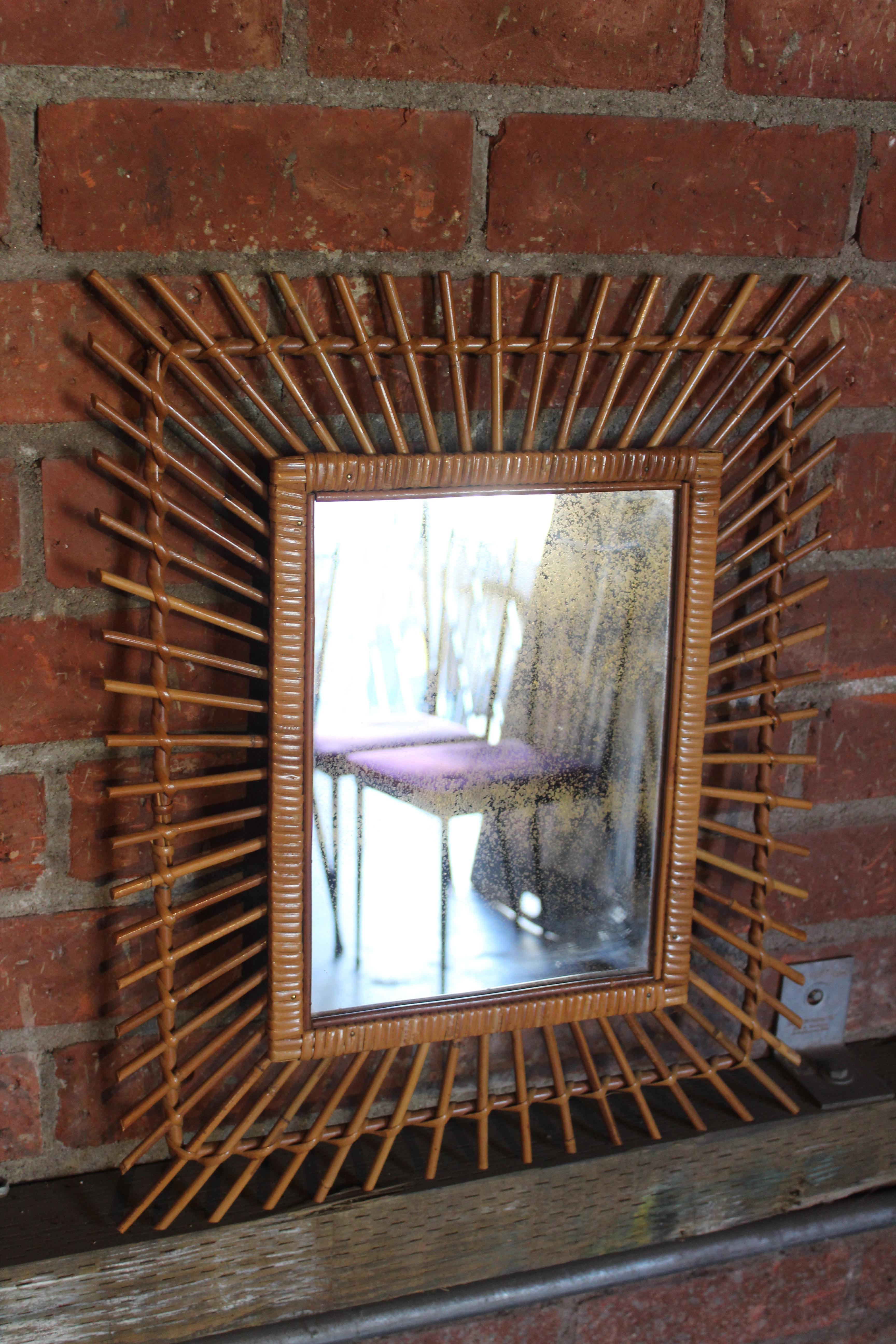A vintage bamboo & rattan mirror with original glass mirror. The mirror has an almost gold finish. In excellent condition.