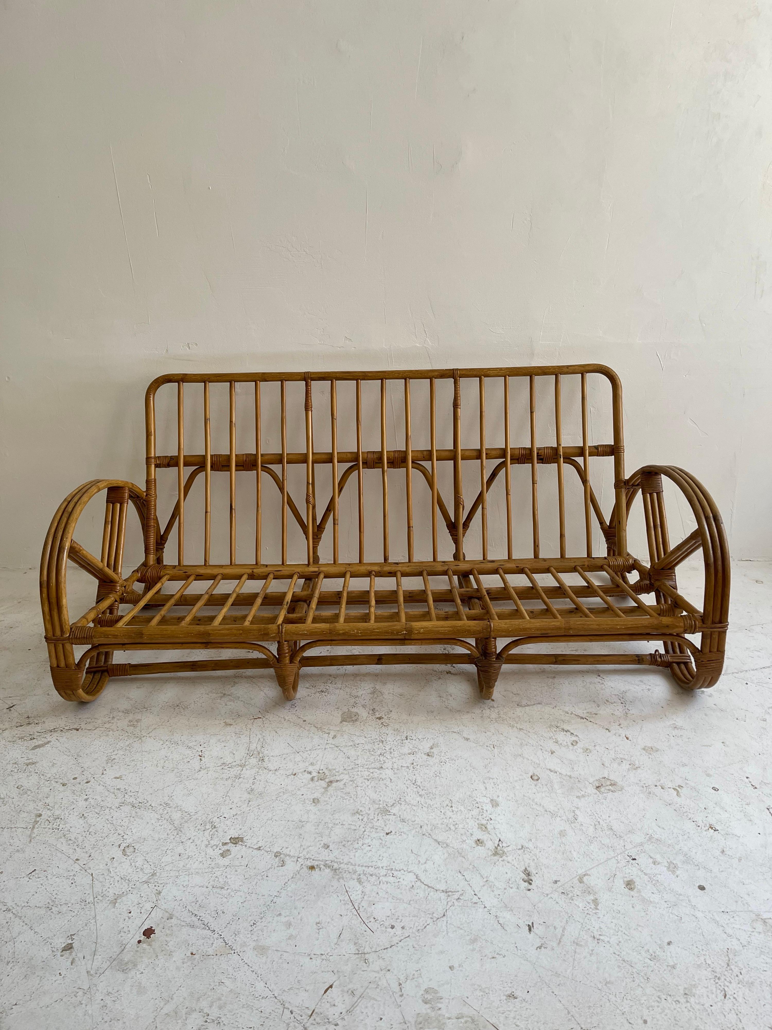 Bamboo rattan pretzel living room suite sofa chairs table, France 1950s. Consists of one sofa, three matching lounge chairs and coffee table.