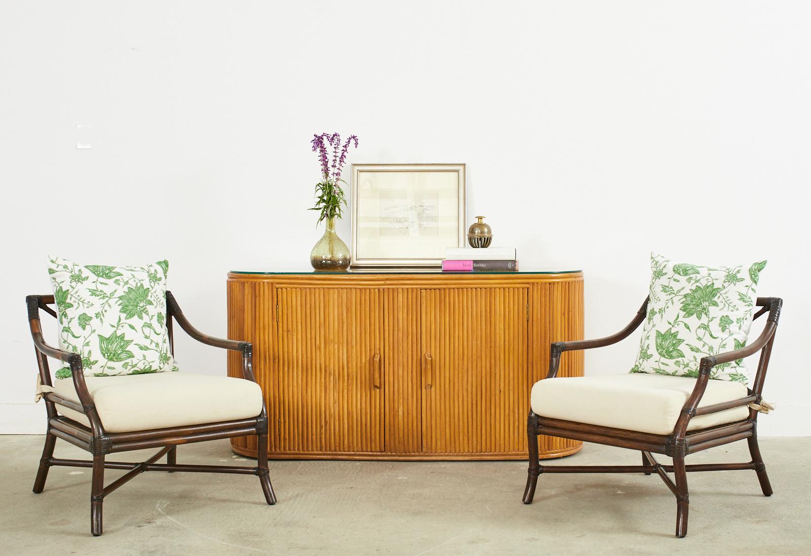 Handsome sideboard credenza that represents everything wonderful about the modern use of rattan. Incredible geometric patterns reminiscent of art deco with modern shapes and lines. While touching modernism the rattan keeps the piece grounded in