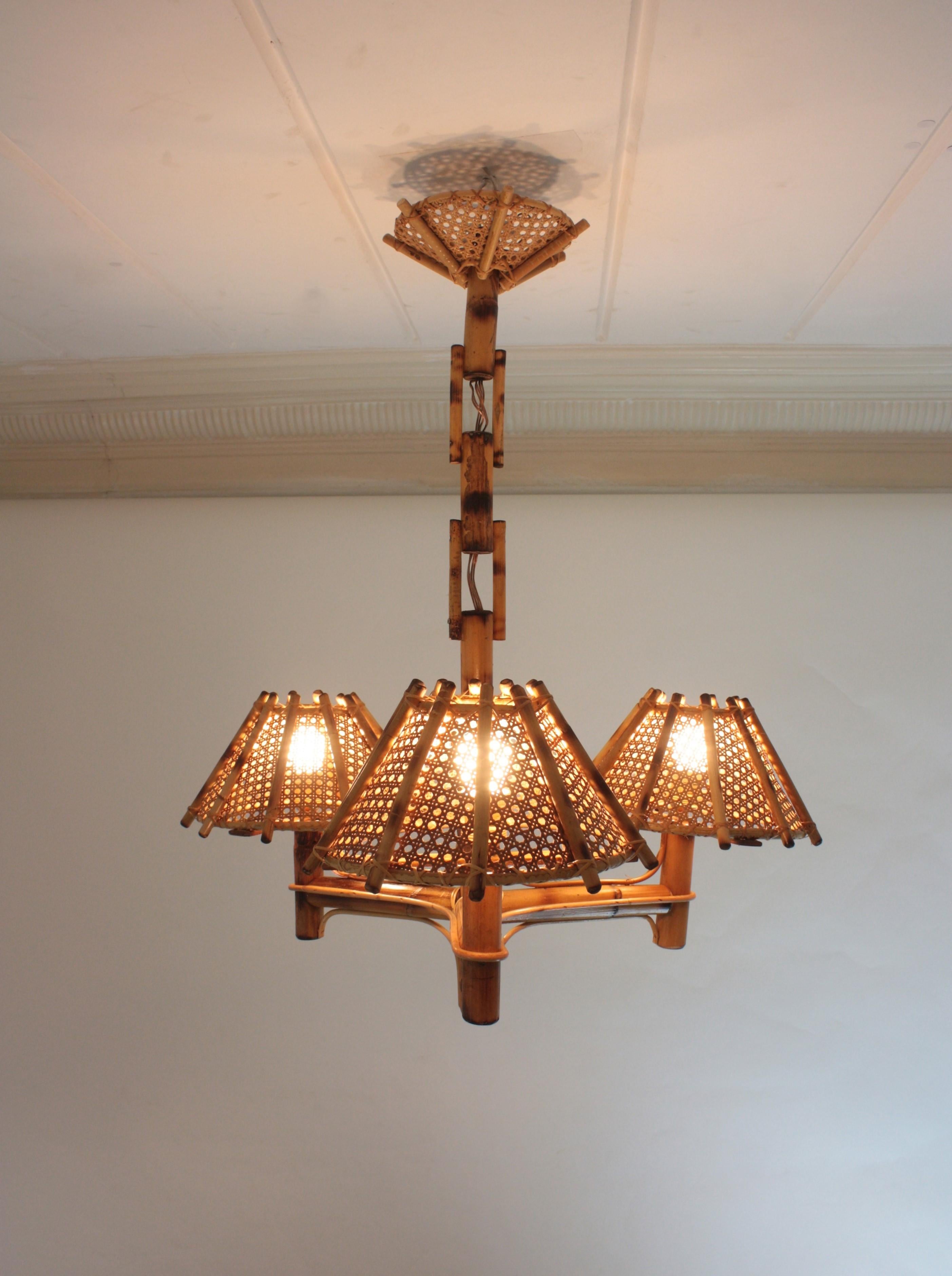 Mid-Century Modern Bamboo Rattan Three-Arm Chandelier with Wicker Conical Lampshades For Sale