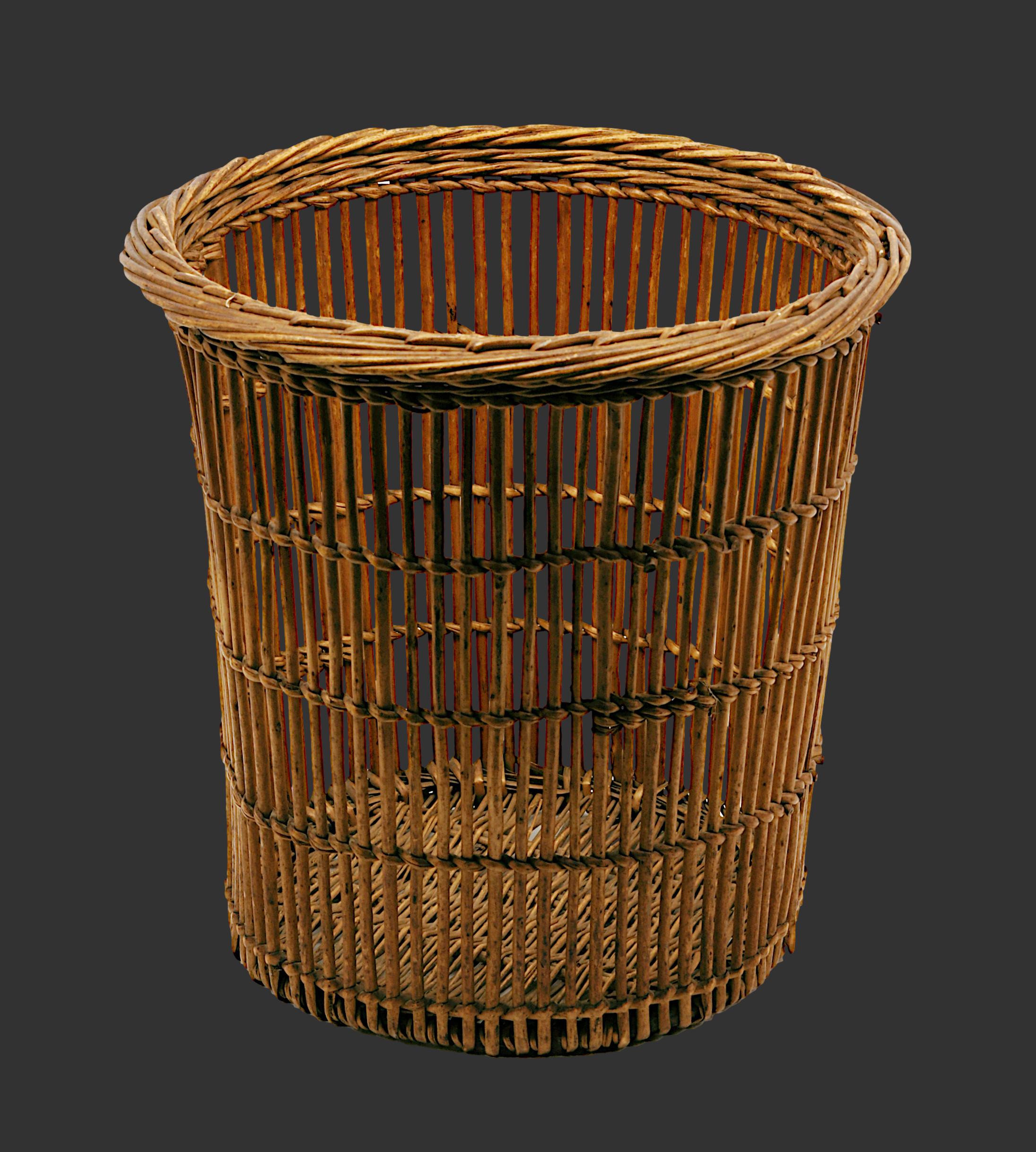 A charming Mid-Century Modern trash can or paper bin crafted from bamboo and rattan in France during the 1950s. This beautifully designed piece combines natural materials with a timeless aesthetic, perfect for adding a touch of vintage charm to any