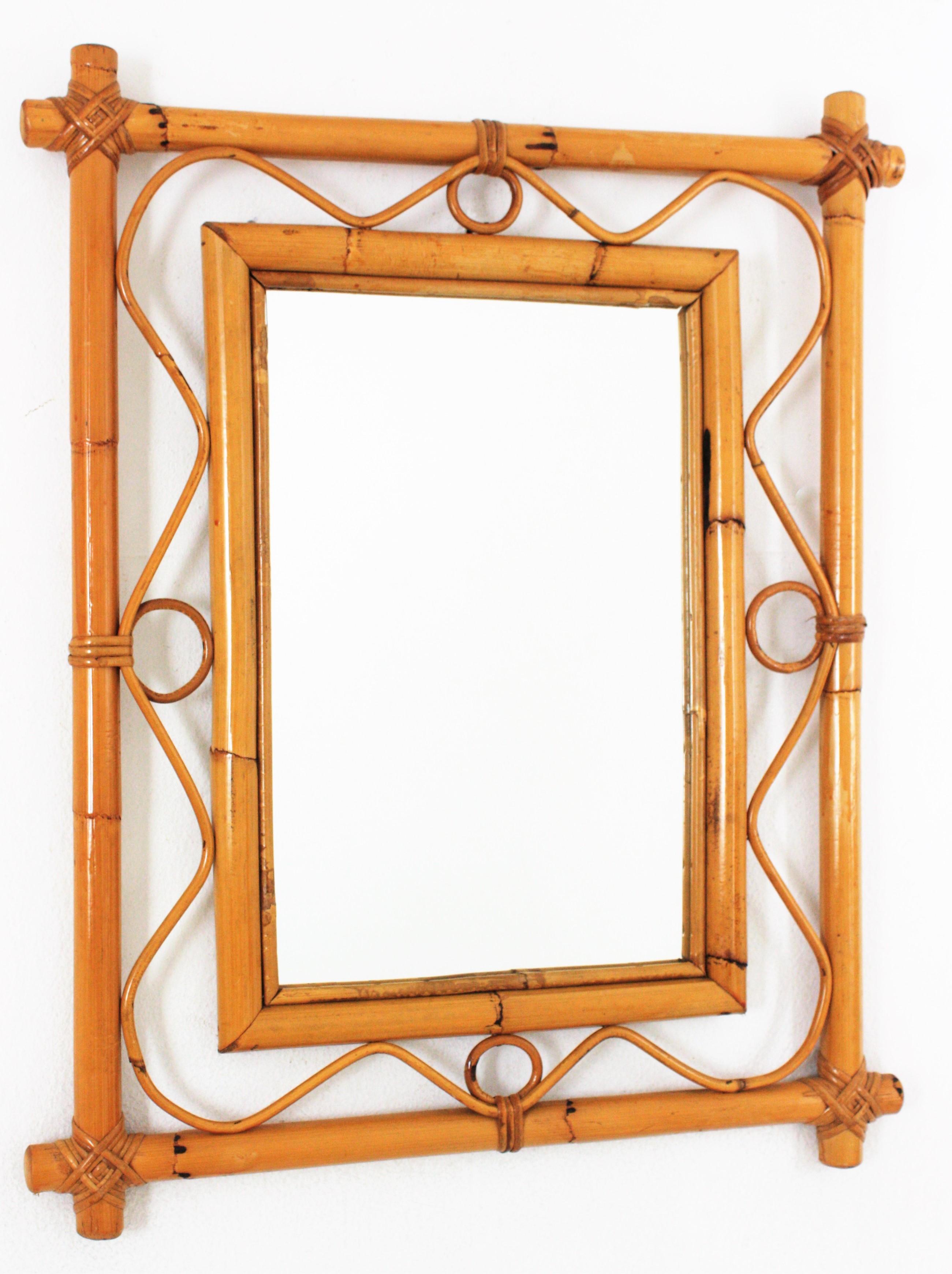 Midcentury rectangular mirror, Rattan & Bamboo
Eye-catching Mid-Century Modern Franco Albini style handcrafted bamboo rattan mirror. Italy, 1960s.
This mirror features a double bamboo rectangular frame with wavy rattan decorations between the