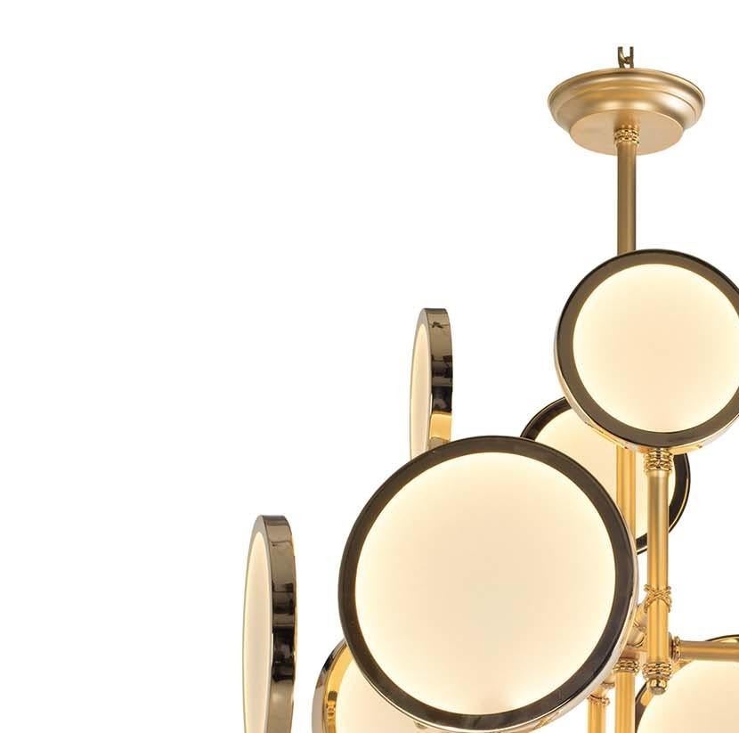This captivating chandelier reinterprets traditional light fixtures with a contemporary edge to create a timeless objet d'art that will complement any decor. The linear frame, fashioned of brass with a satin gold finish, features a central rod