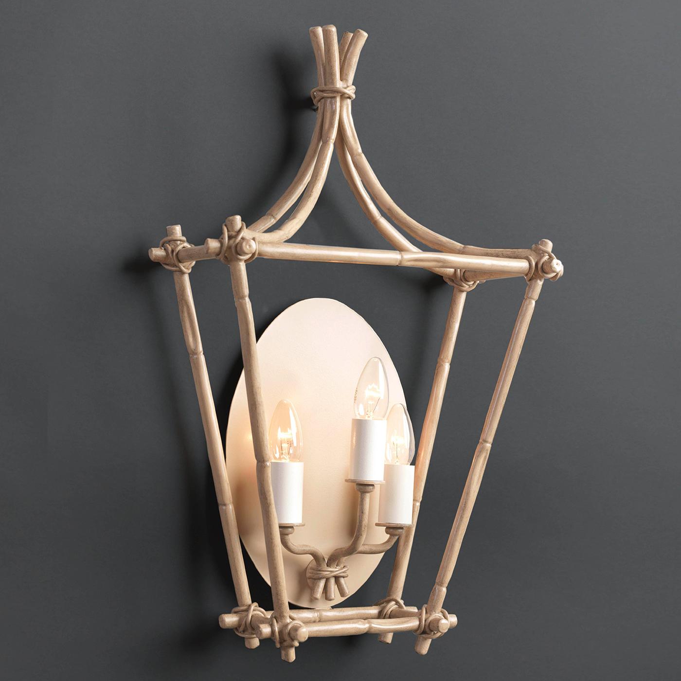This stunning sconce is part of the Bamboo Collection. The skillful hands of Officina Ciani's craftsmen forge the stainless steel structure to reveal the fine elements with the texture and shape of bamboo sticks. An ideal accent to a rustic-chic or