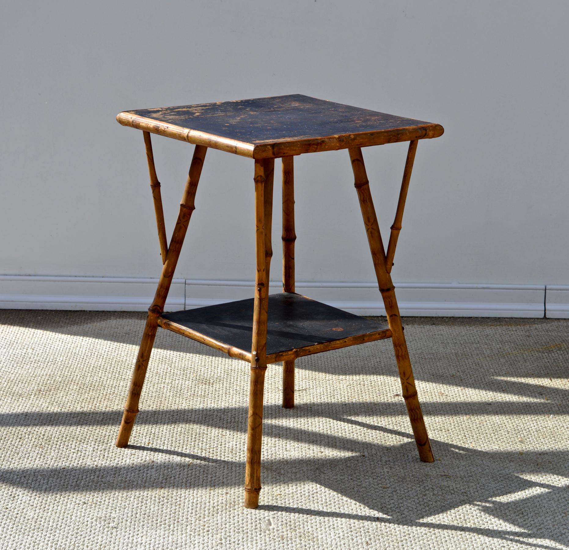 A good looking antique bamboo side table in the British Colonial taste. This light and airy traditional leaning occasional table is a chameleon classic in that it can be employed in such a wide array of spaces. 
Our favorite usage of this