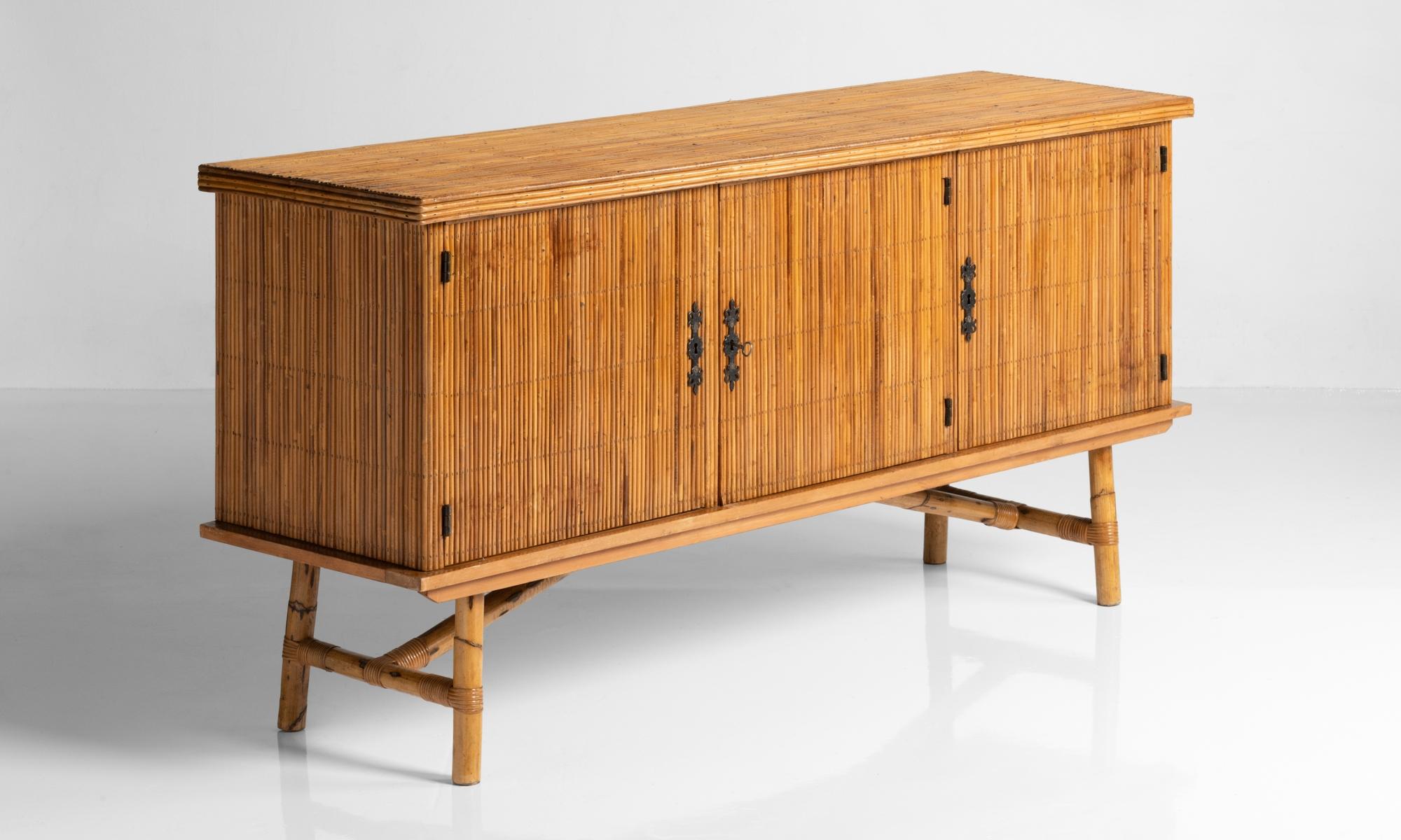 Bamboo sideboard, France, circa 1940

Unique form with bamboo paneling throughout.