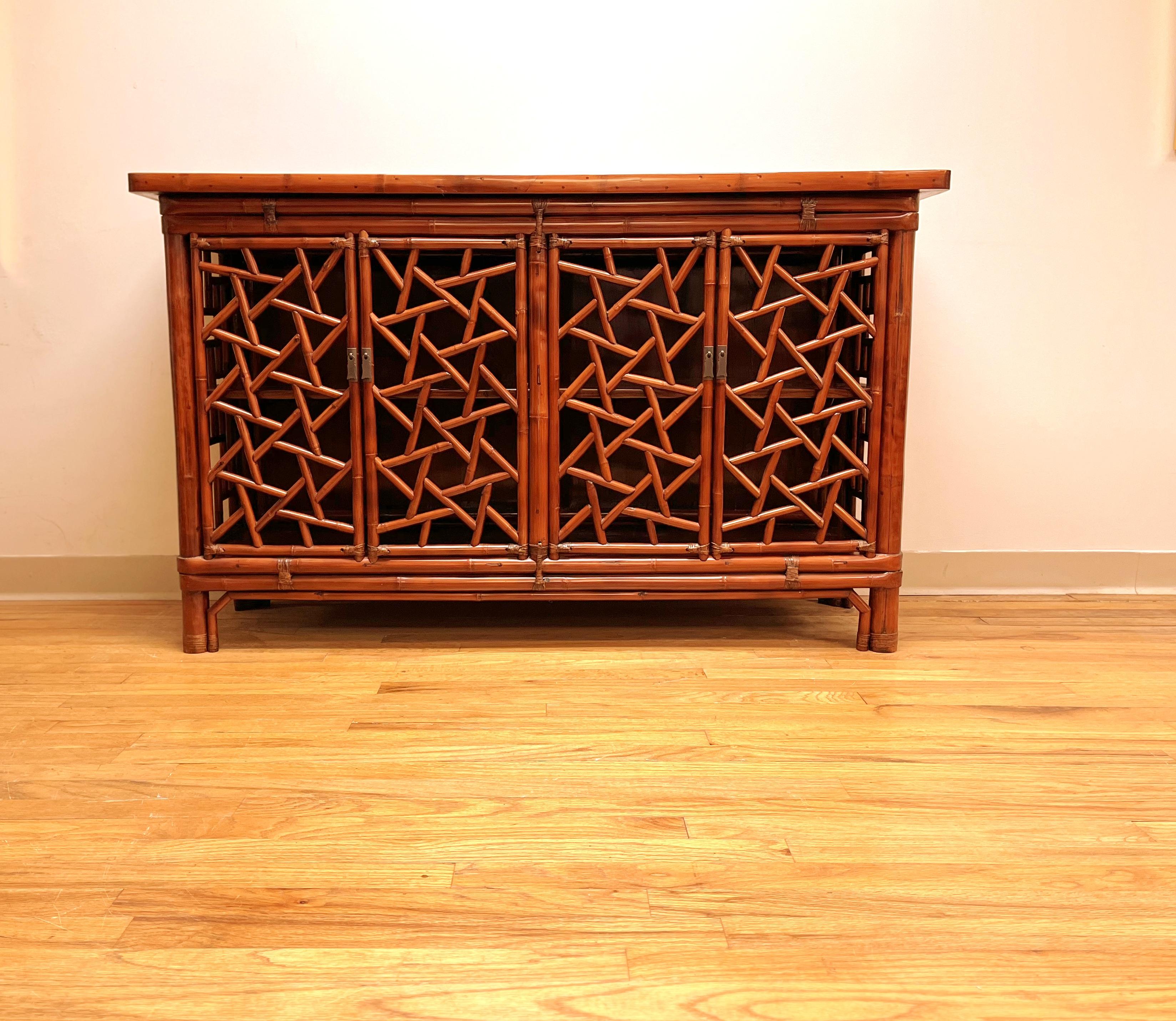 Bamboo sideboard with geometric lattice work on two pairs of doors and sides, black lacquer top,
 excellent workmanship