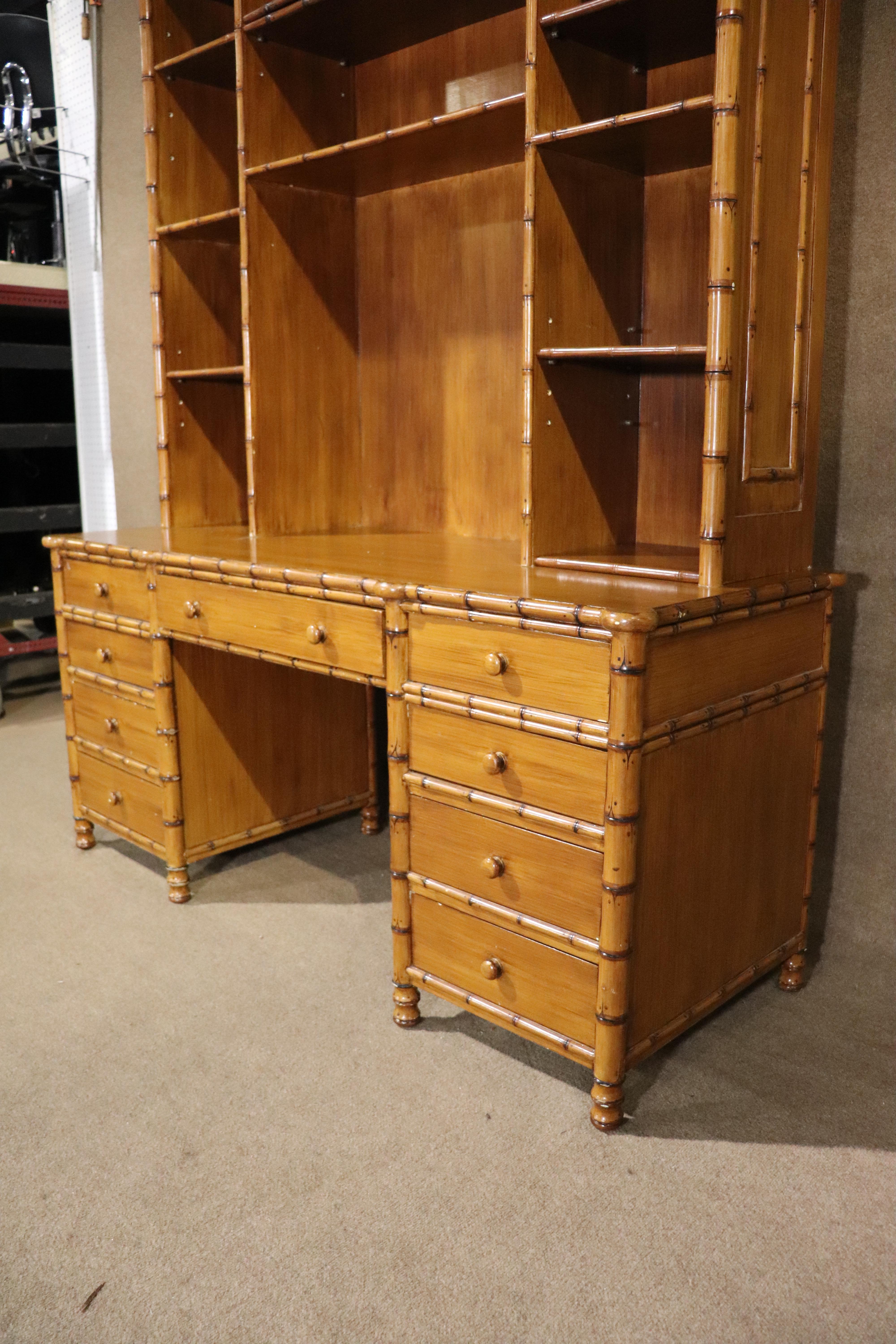 This large desk unit and chair are made with a bamboo style wood. Great detailing and ample storage. Desk has nine drawers and the topper has many adjustable shelves.
Chair: 38h, 18.25w, 18d, 18 seat height
Please confirm location NY or NJ