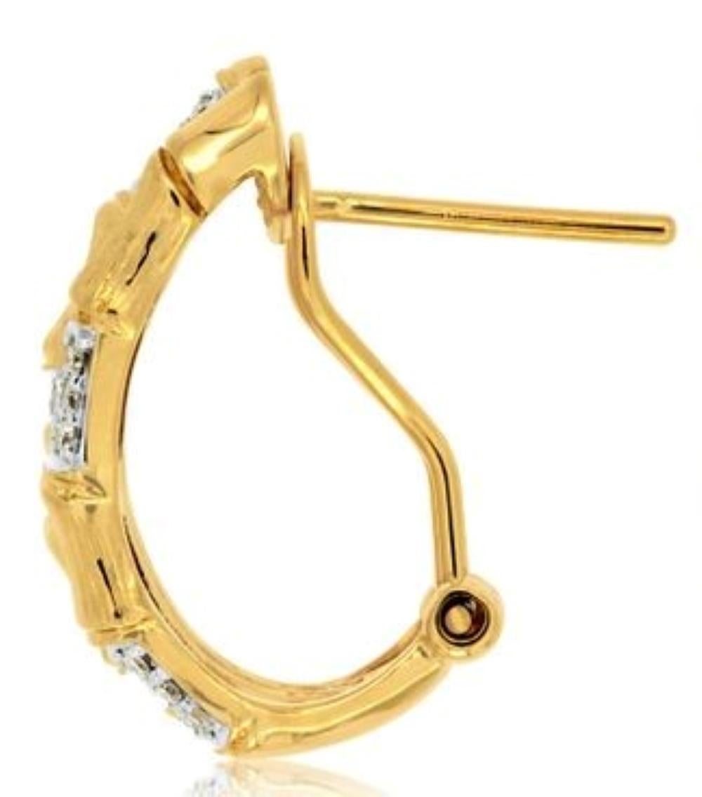 Diamond Bamboo Style Earrings, the 84 Round Brilliant Cut Diamonds weigh .34 carats total, 14 karat yellow gold.

Post style earring with omega closure. 