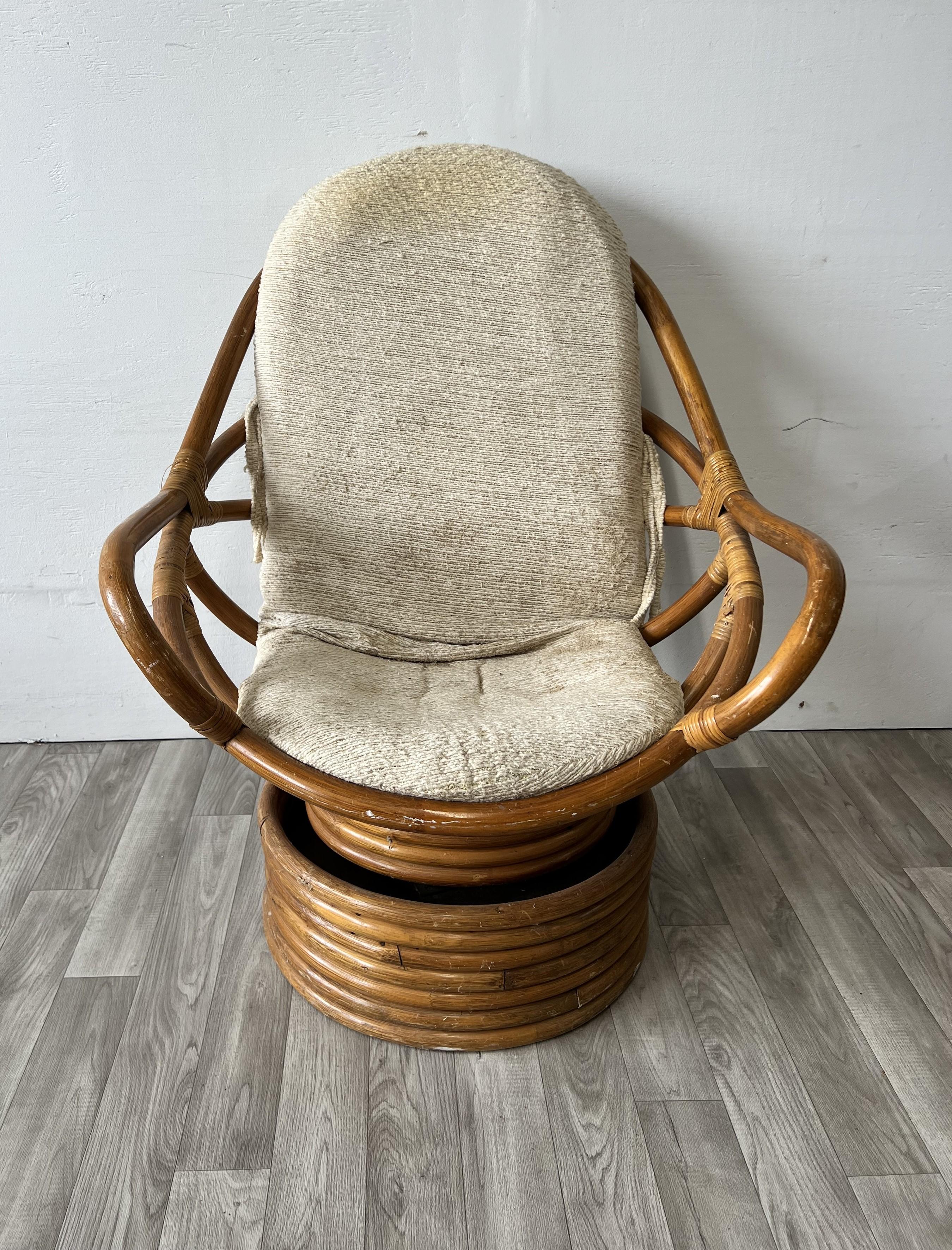 Chair shell rests on a stacked bamboo pedestal base. Chair swivels and tilts to adjust position. 